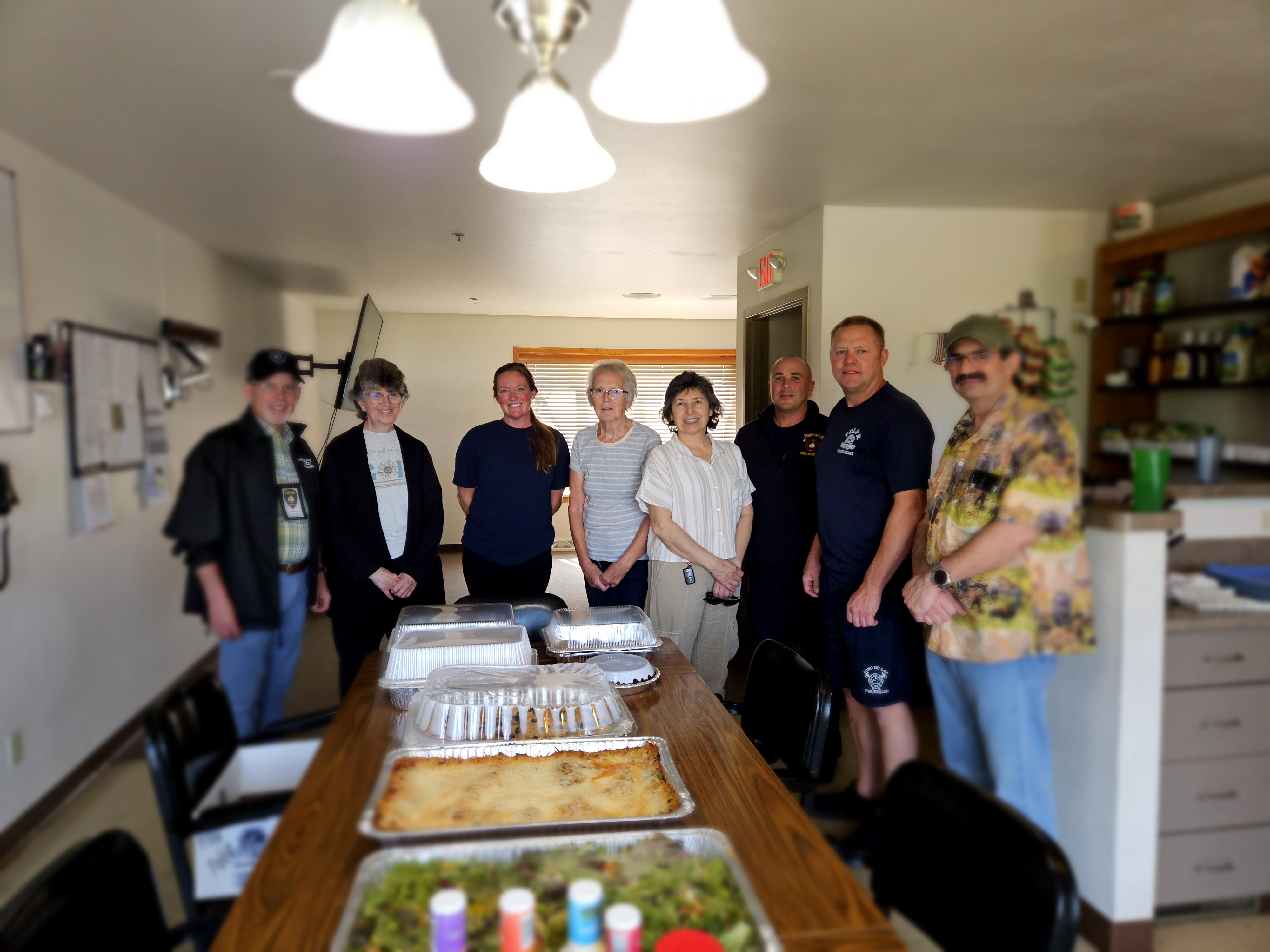 Picture of church members after delivering meal to one of three stations in Fond du Lac. All the fixings for a delicious lasagna meal.