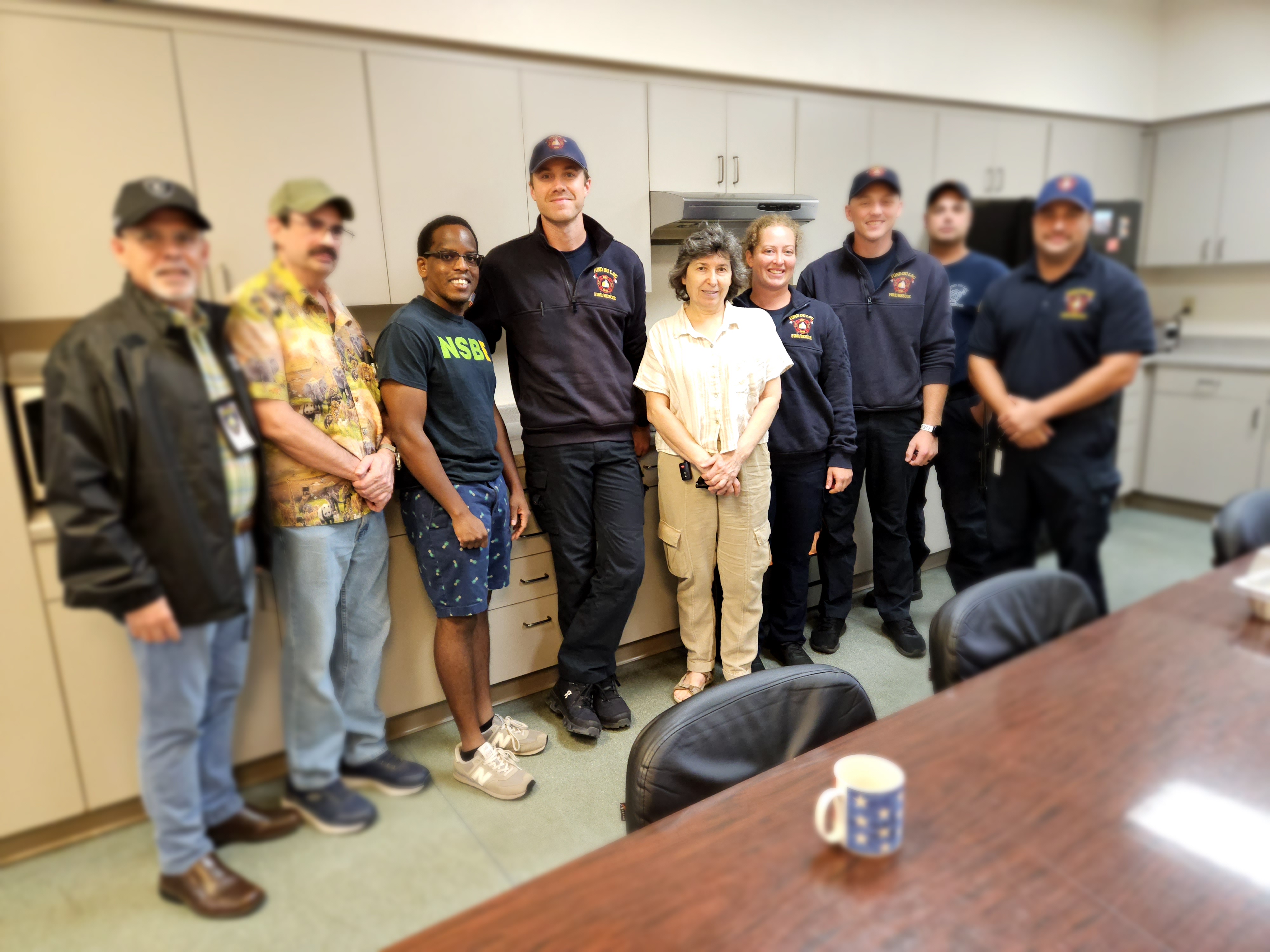 Members with Firefighters with a meal. 