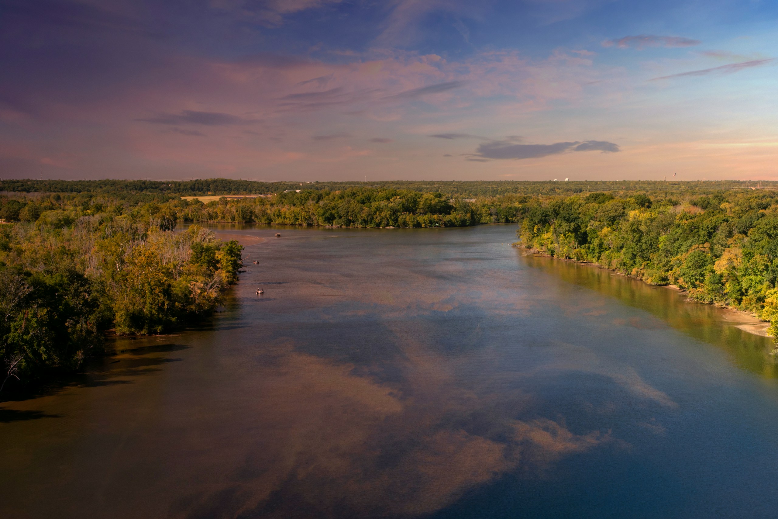 a river with trees on the side