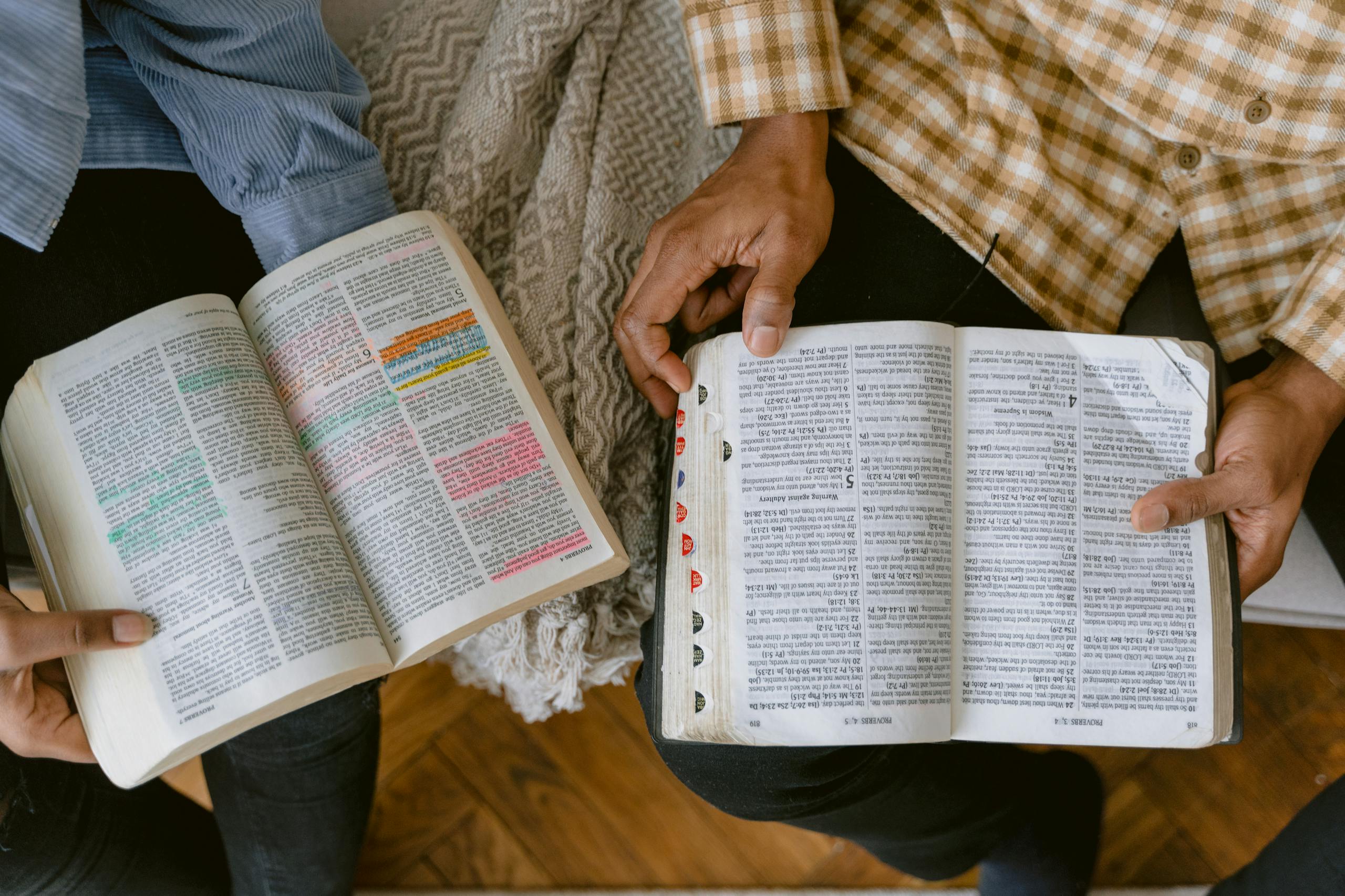 Two adults reading bible.