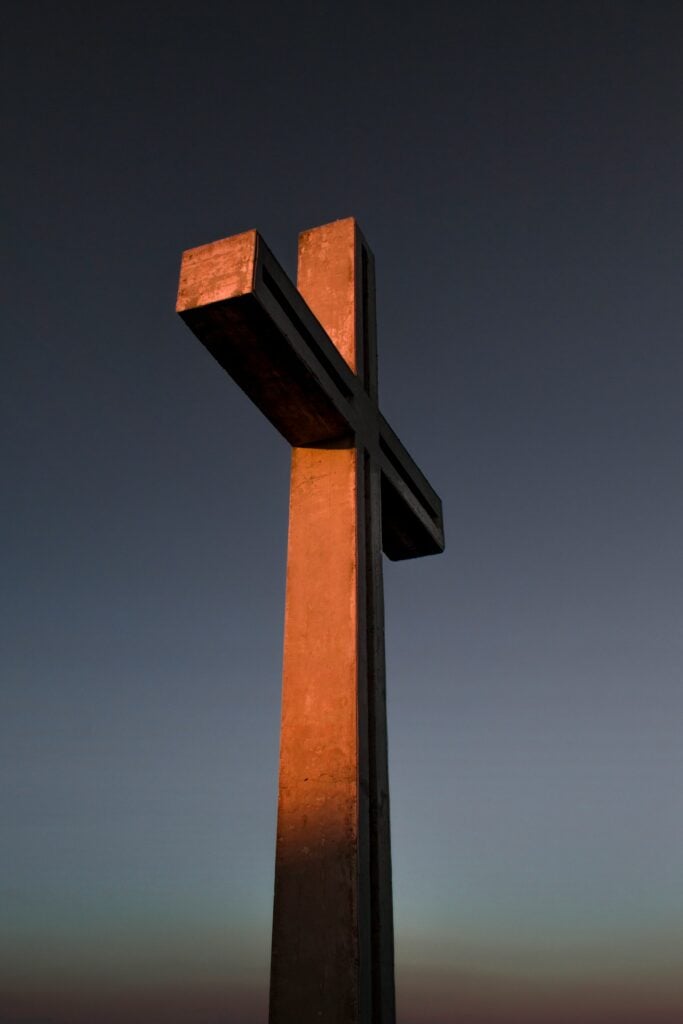 brown wooden cross under blue sky during daytime