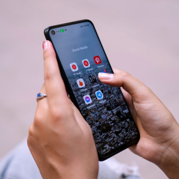 a woman holding a cell phone in her hand