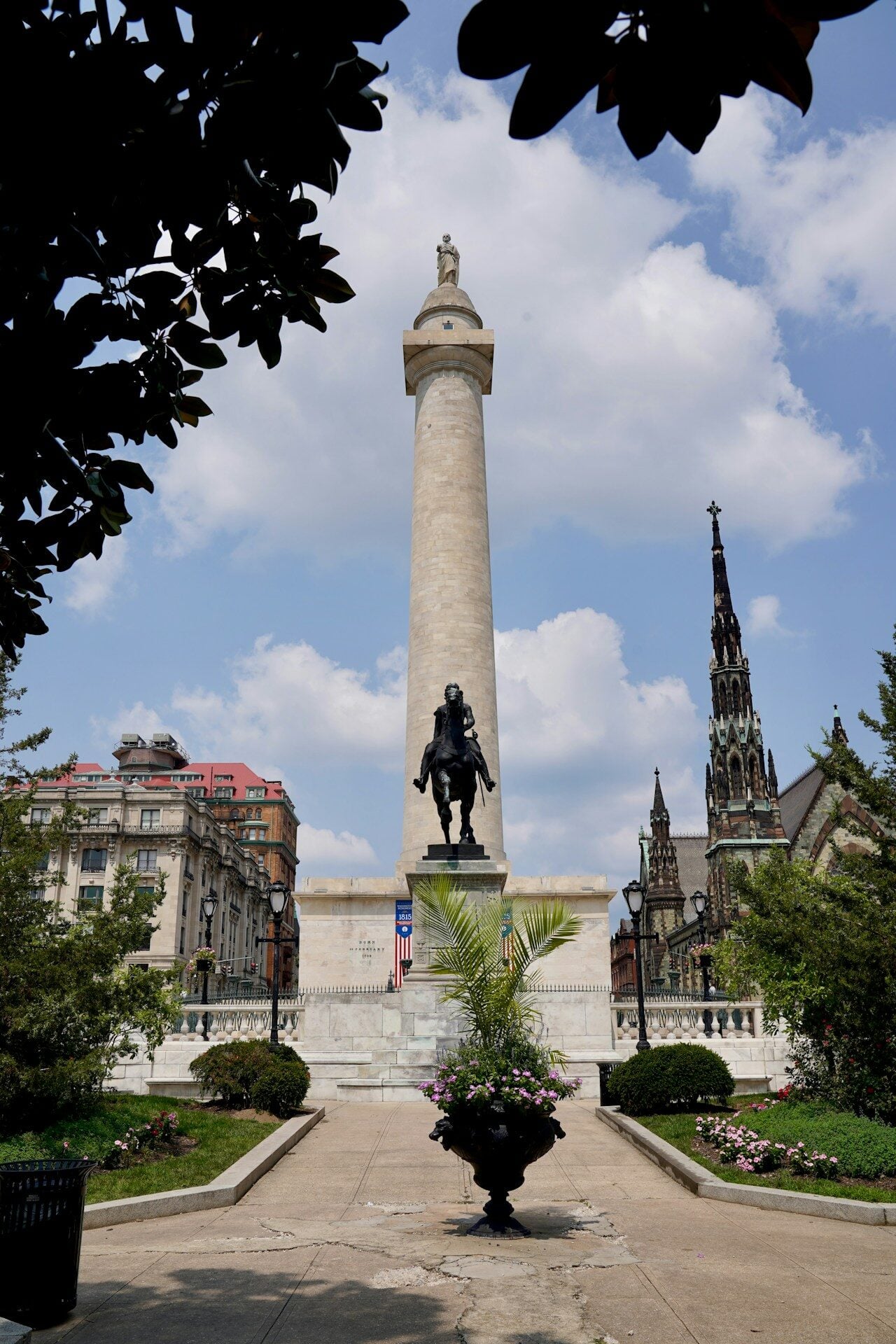 A statue of a man is in the middle of a courtyard