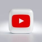 a white square button with a red arrow on it