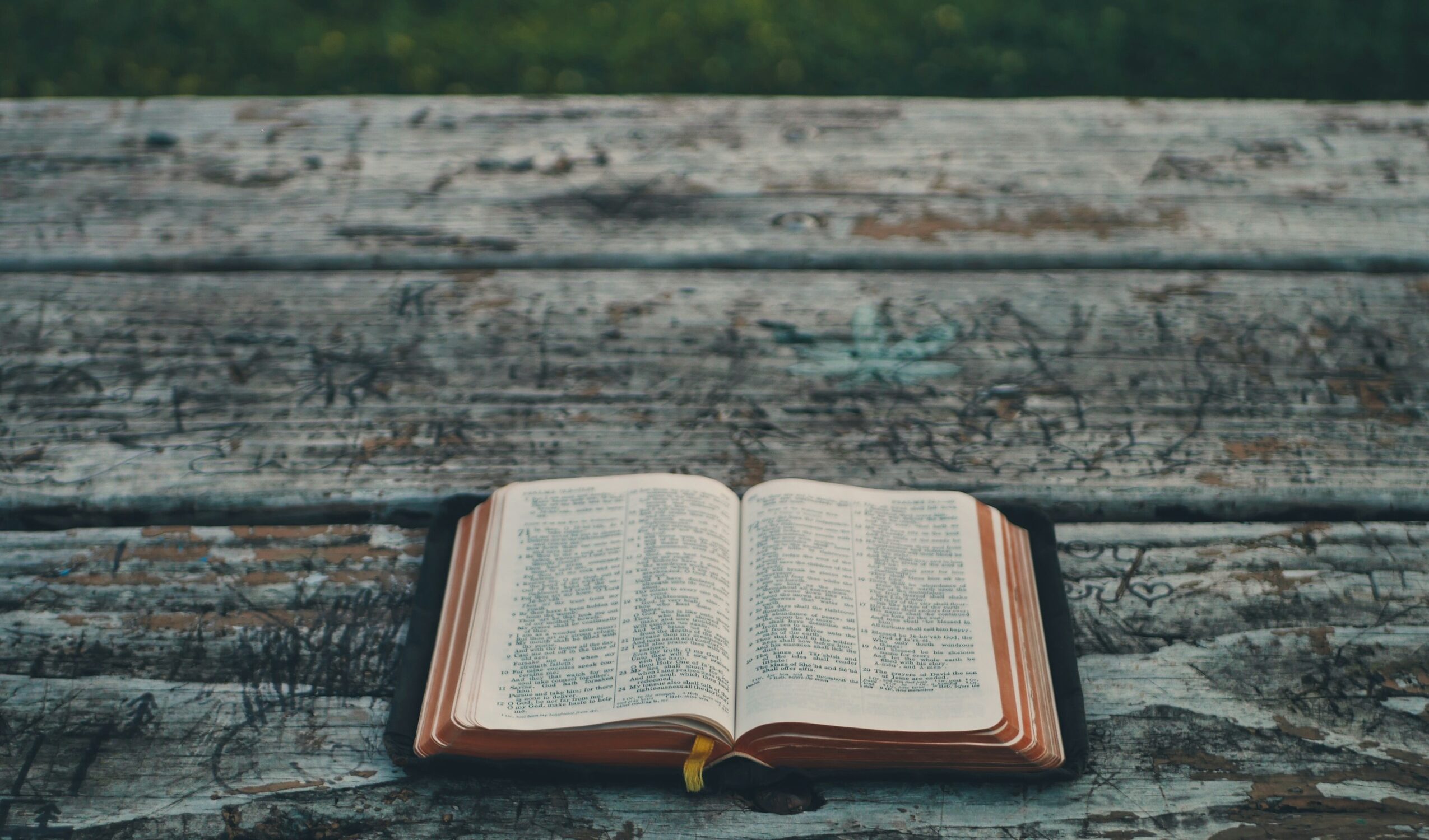 black book on gray wooden table
