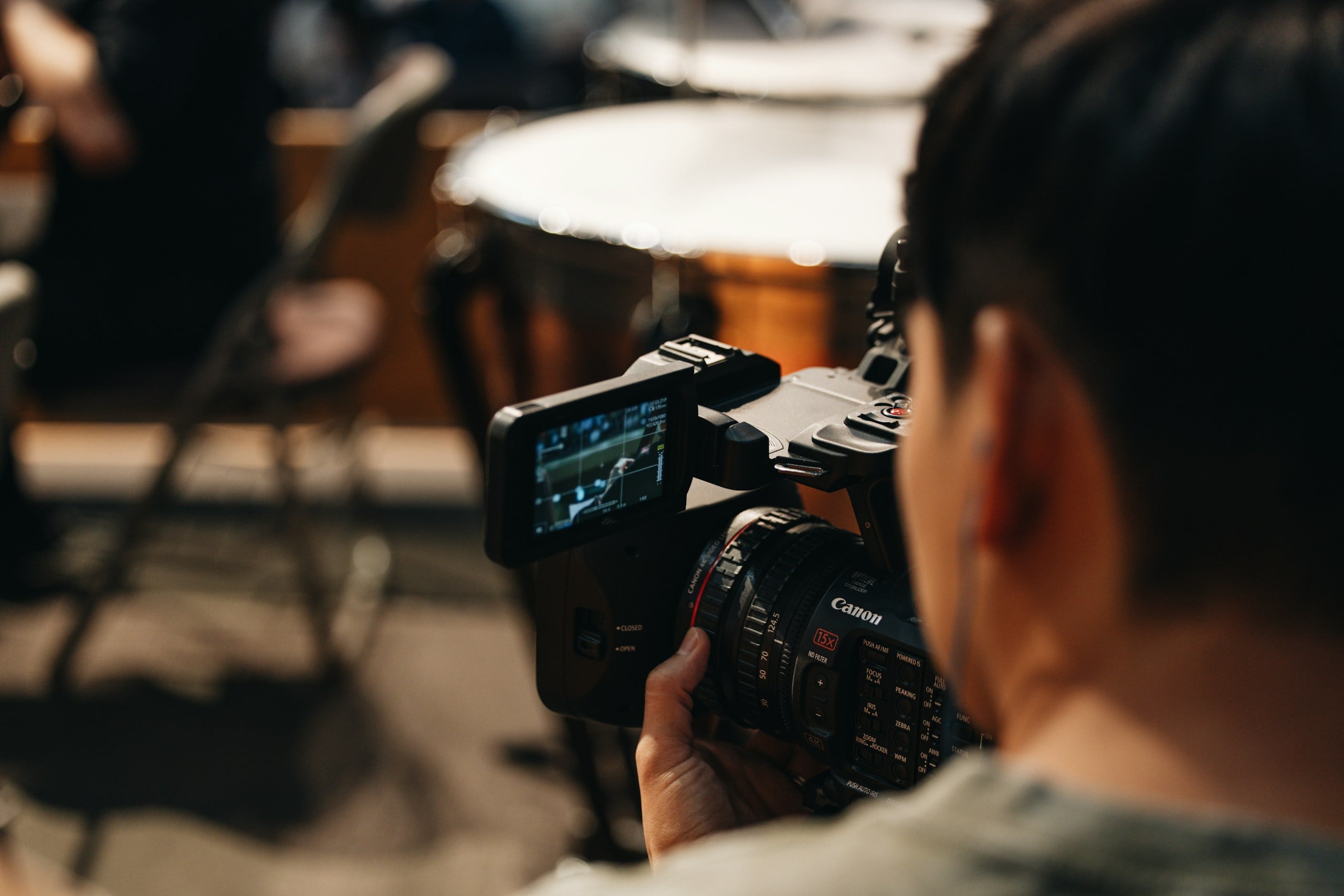 A woman holding a camera up to take a picture