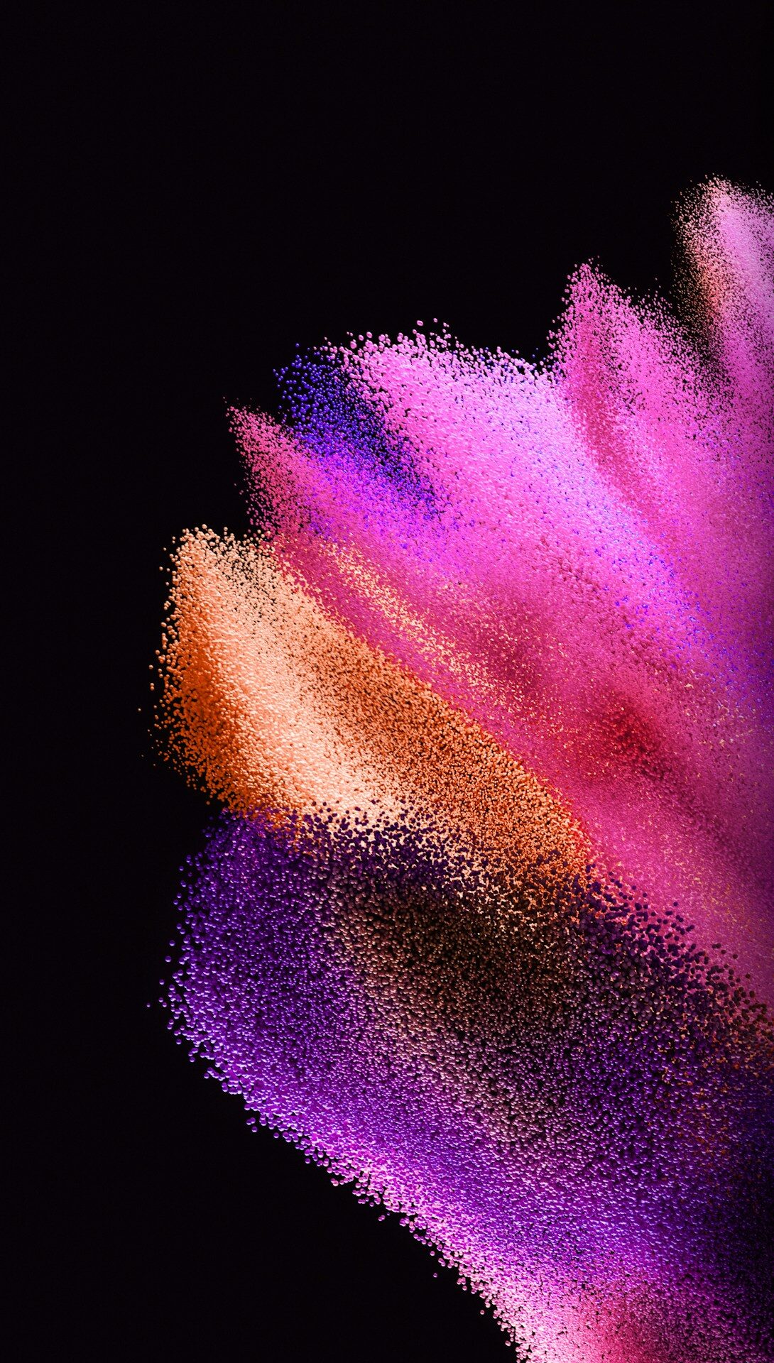 Abstract explosion of pink, purple, and orange powder.