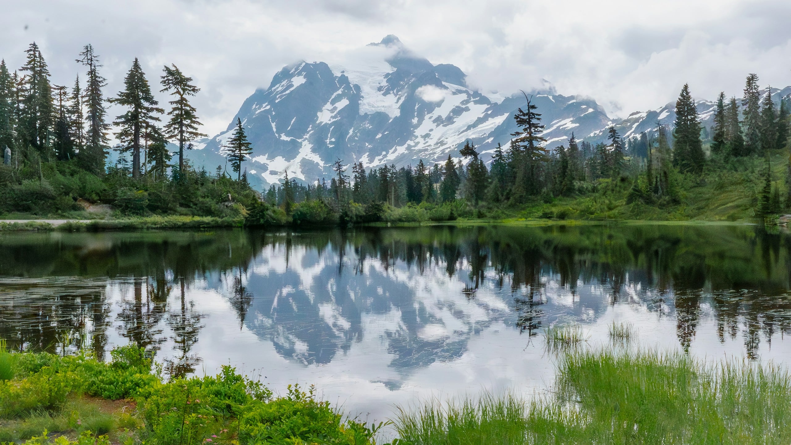 A lake with a mountain in the background