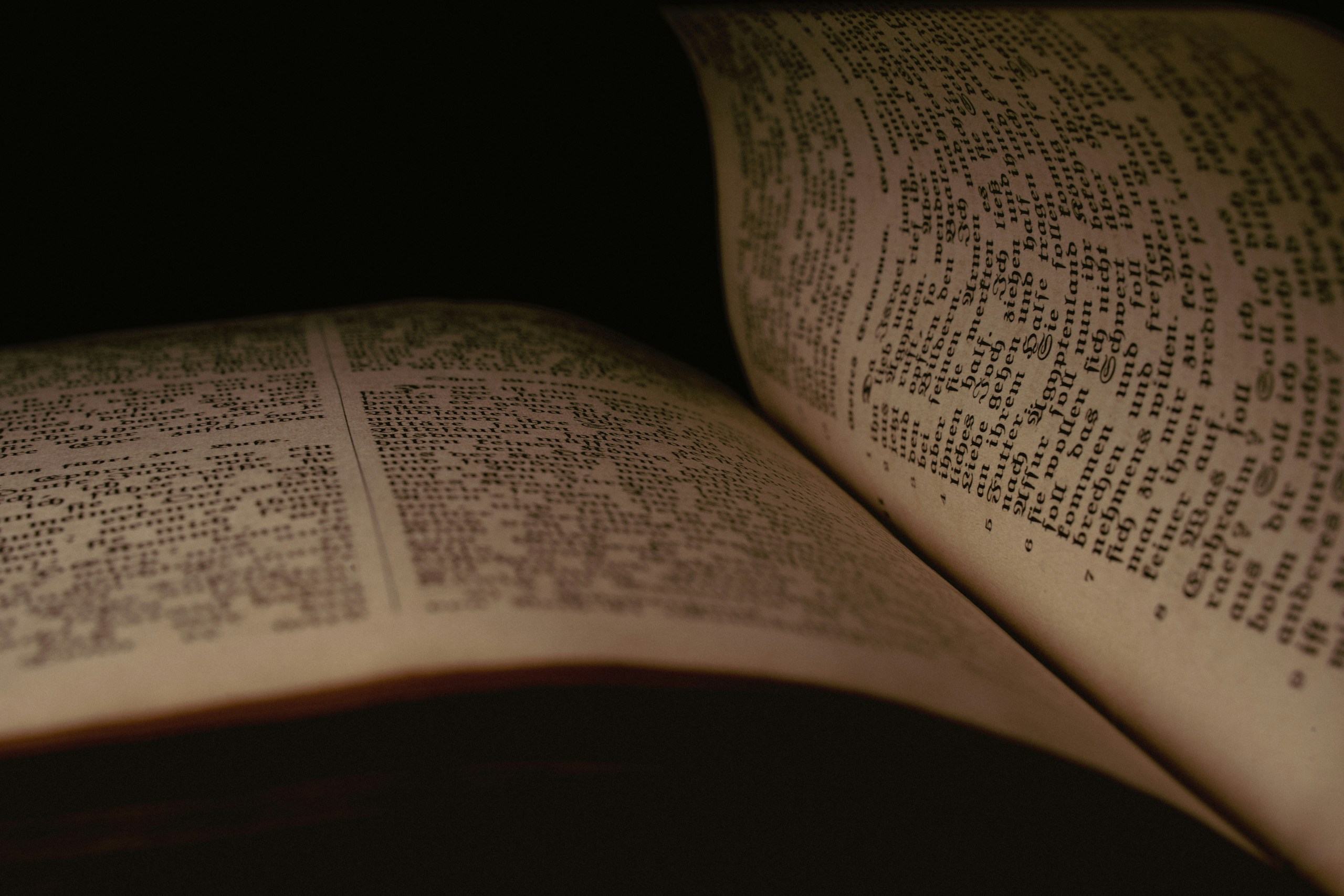 a close up of an open book on a table