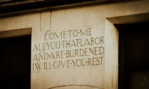 Engraved text on a stone pillar offers rest