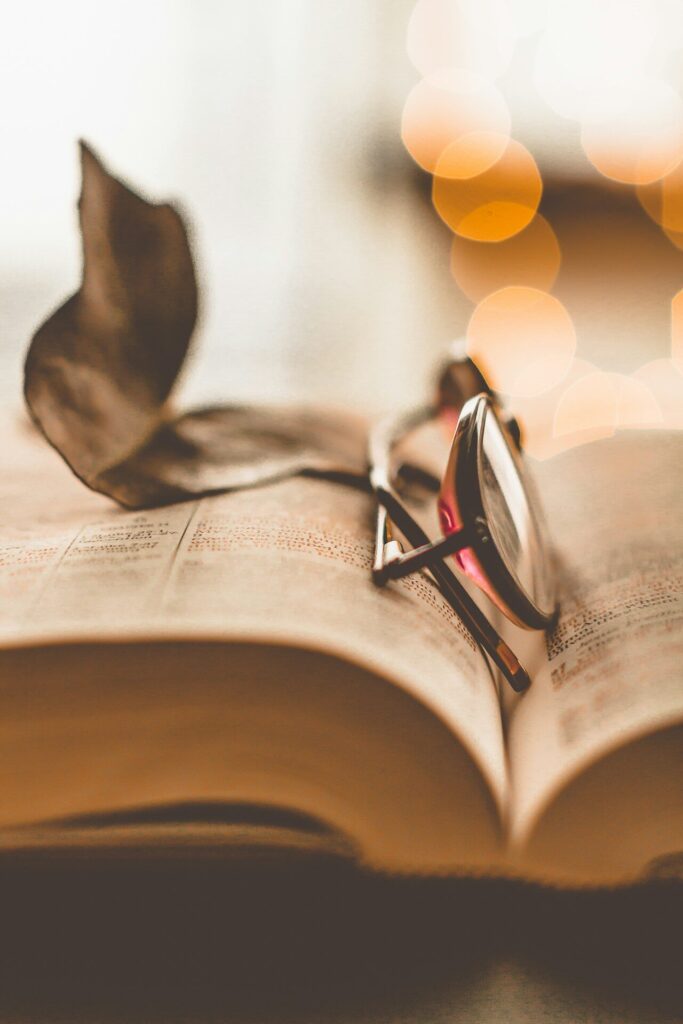 a book with a pair of glasses on top of it
