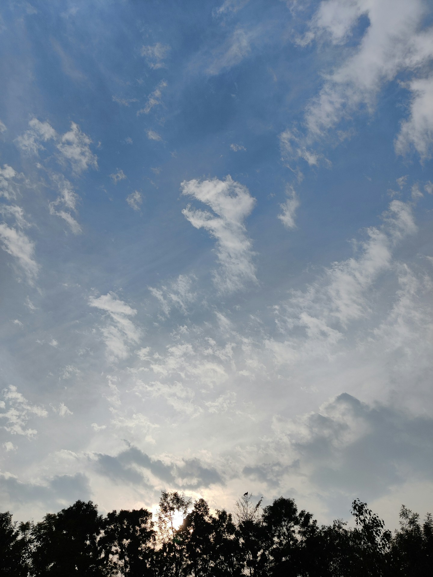 the sun is shining through the clouds in the sky