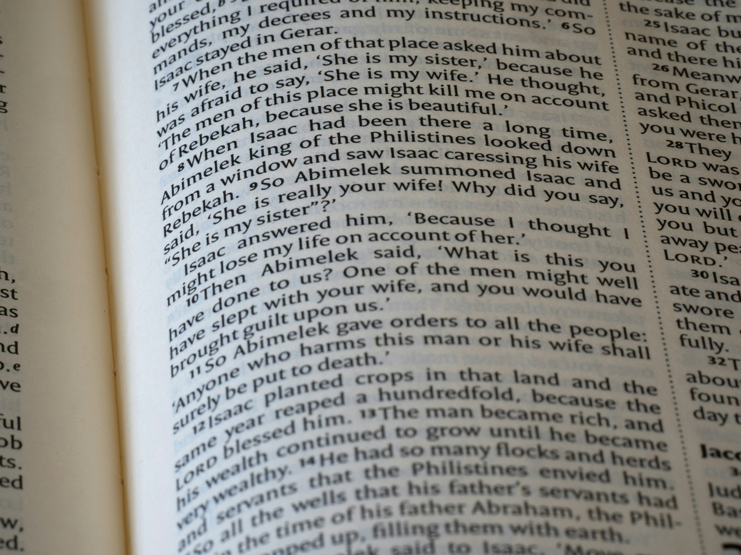 Close-up of an open book with text on pages.