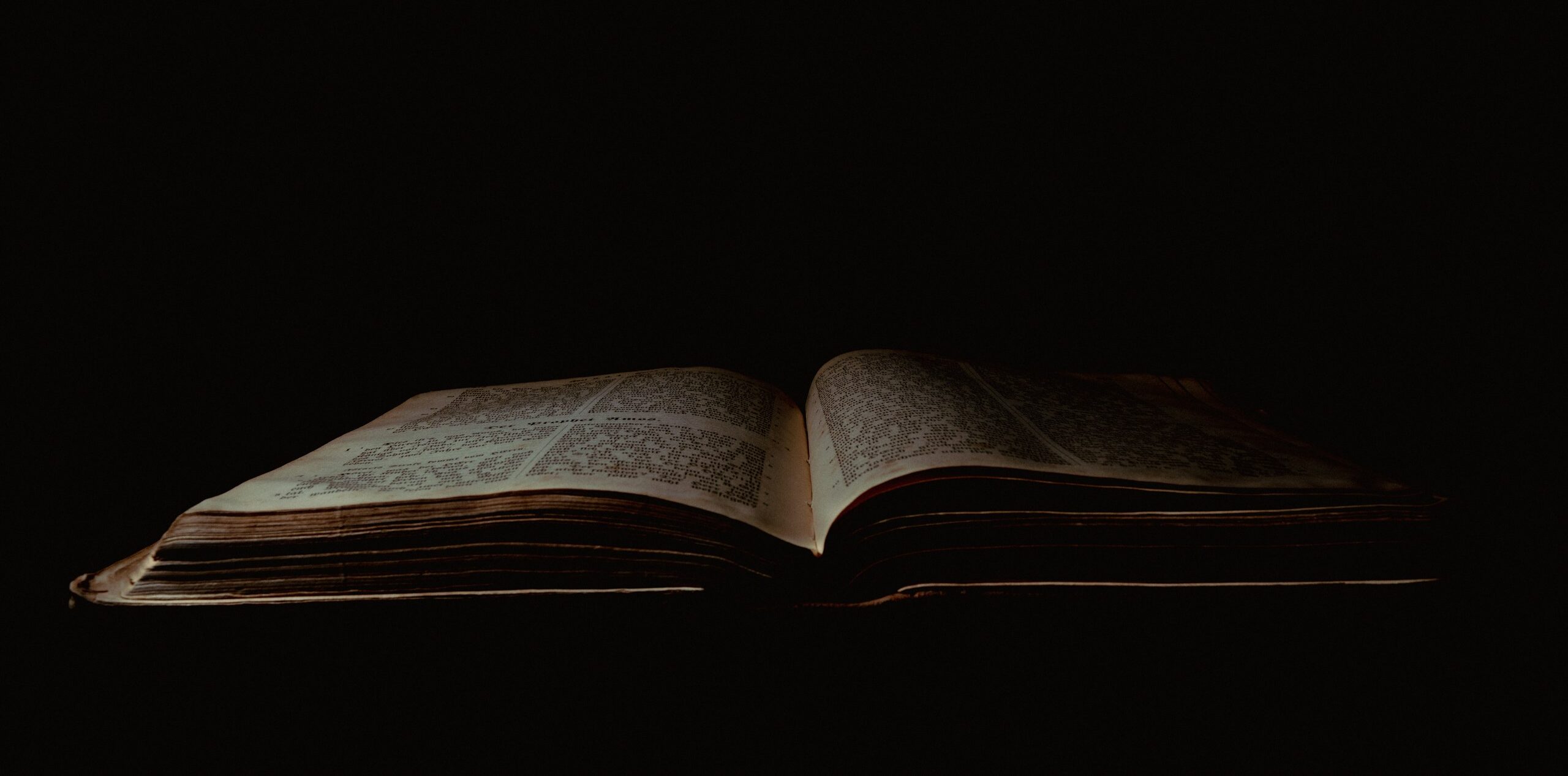 an open book sitting on top of a table