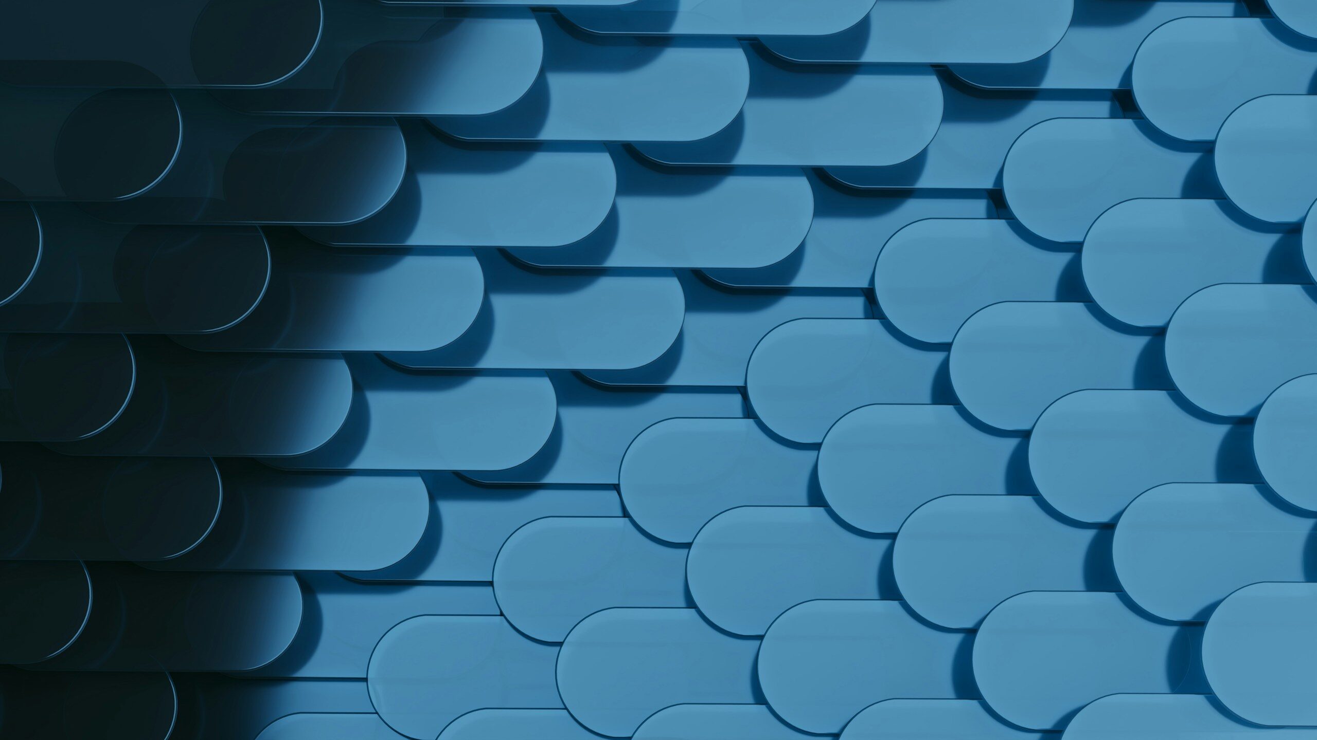 A repeating pattern of rounded blue tiles