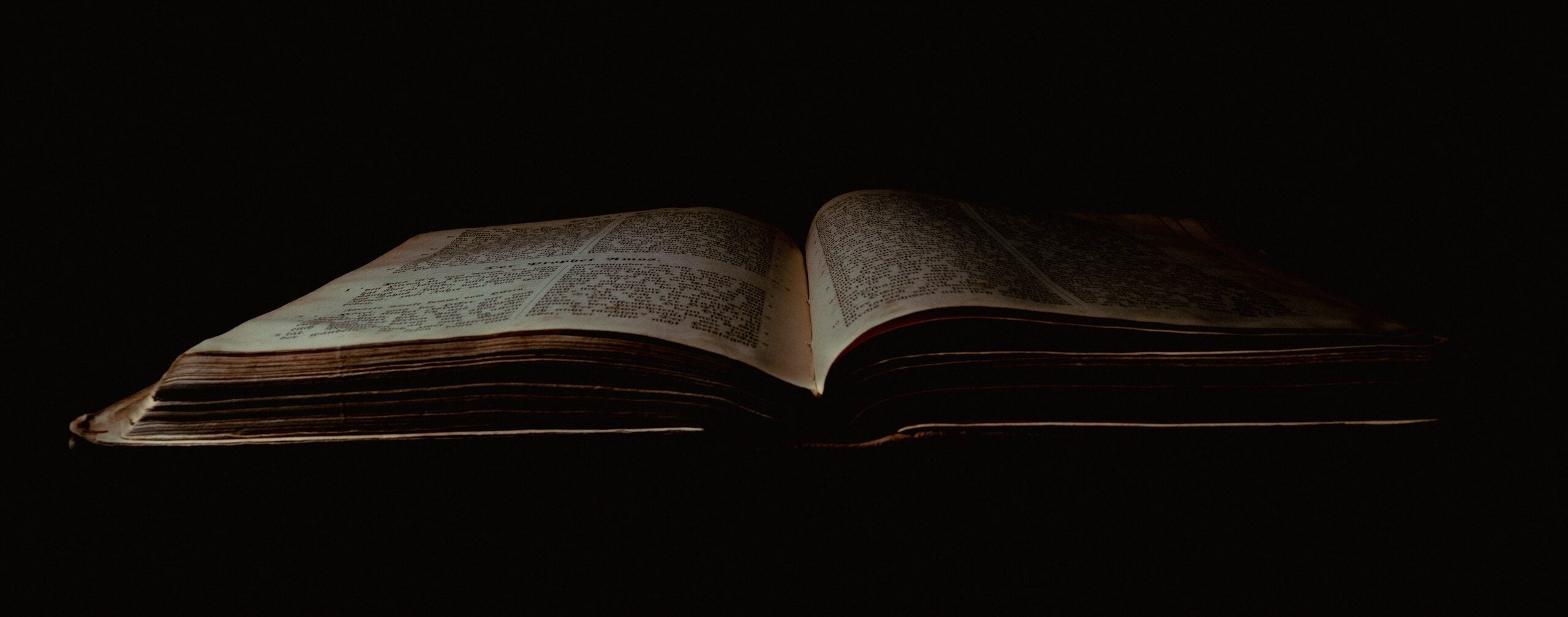 an open book sitting on top of a table
