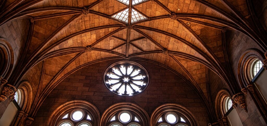 the ceiling of a large cathedral with many windows