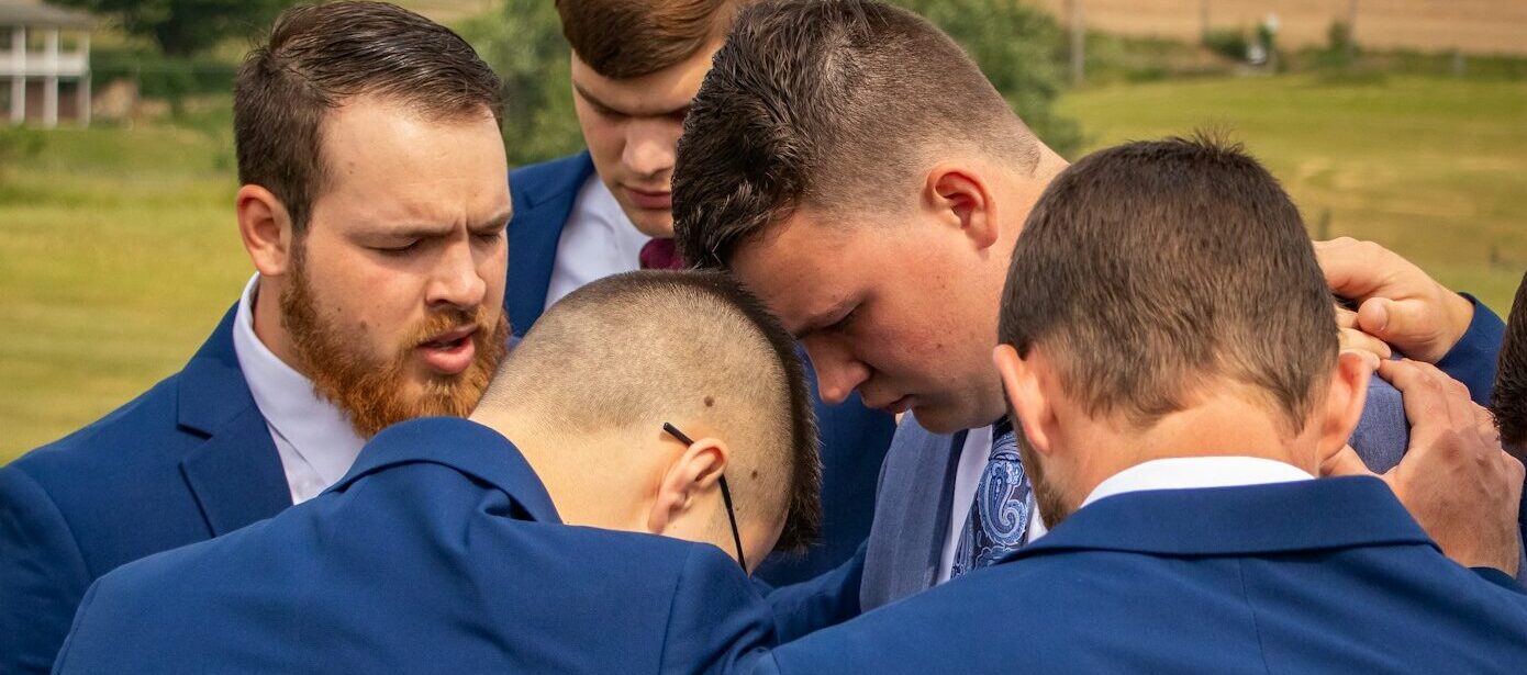 a group of men standing next to each other