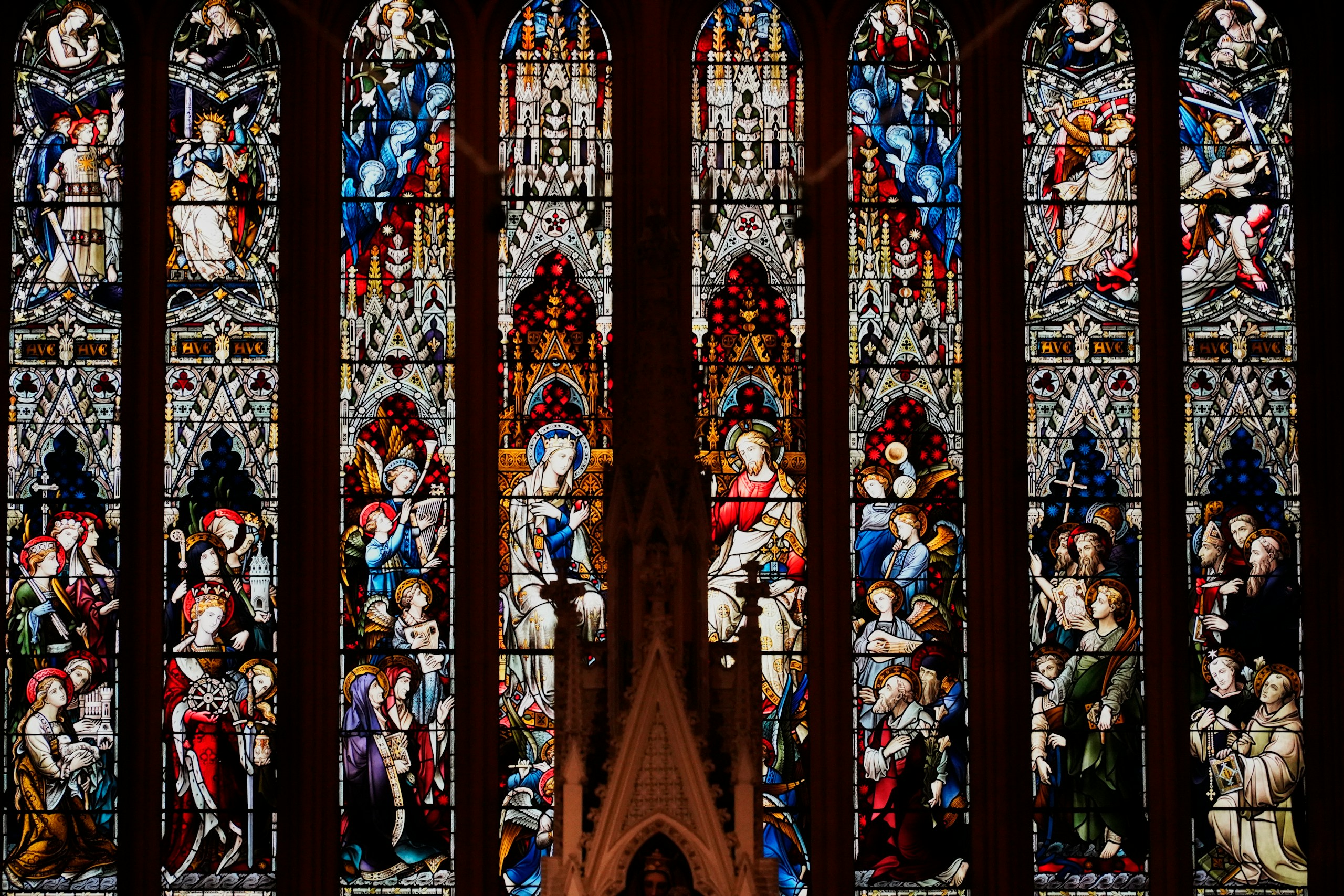 a group of statues in a window