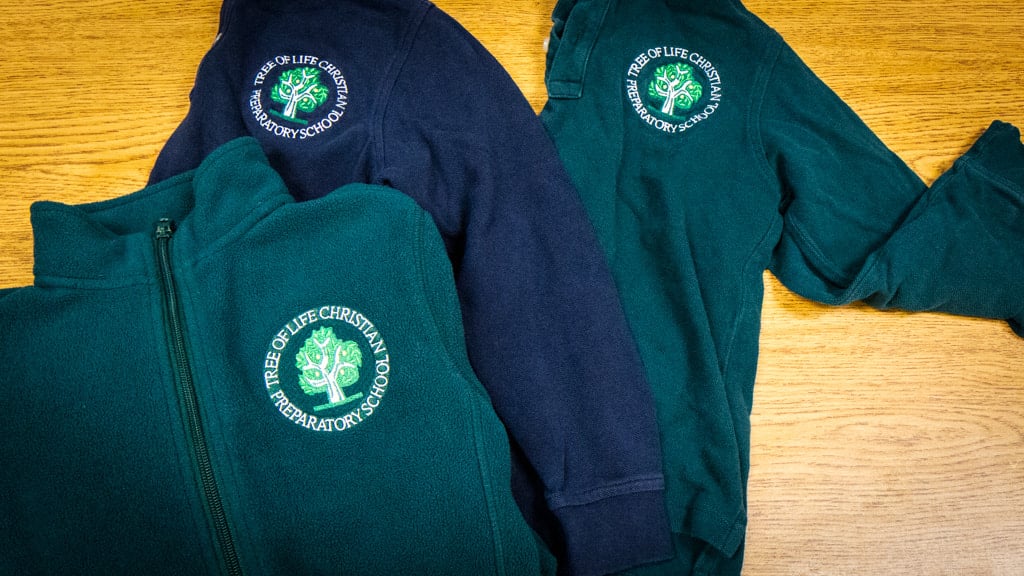 TLC Prep logo polos and fleece examples