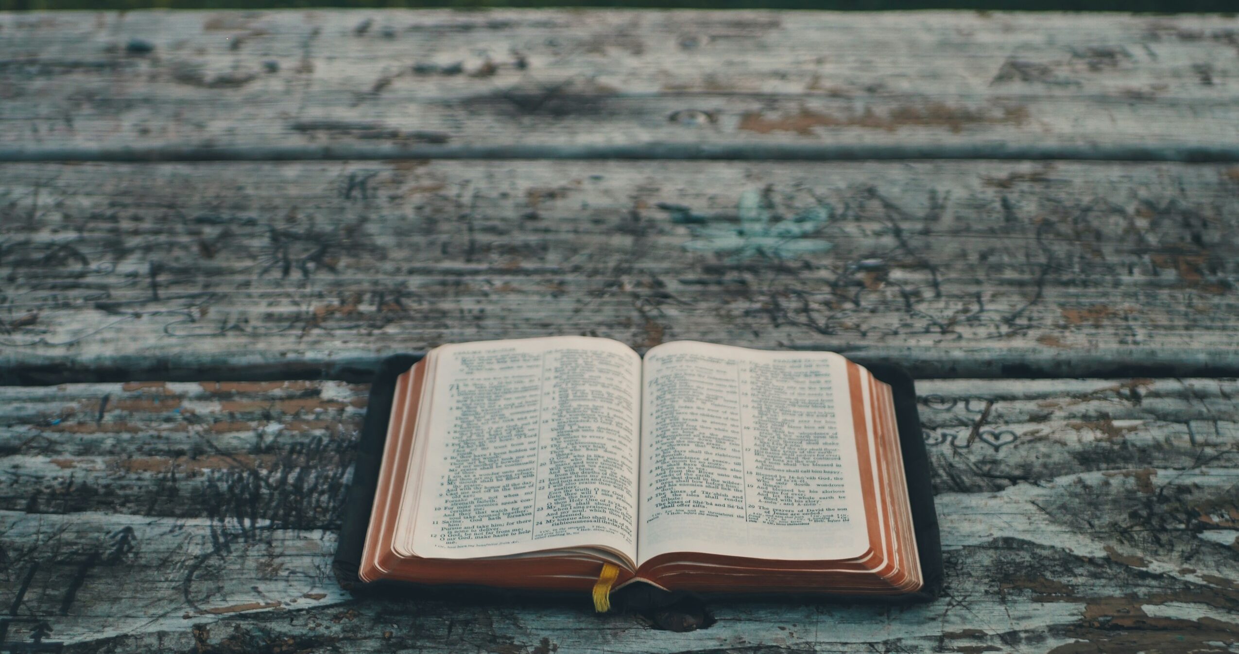 black book on gray wooden table