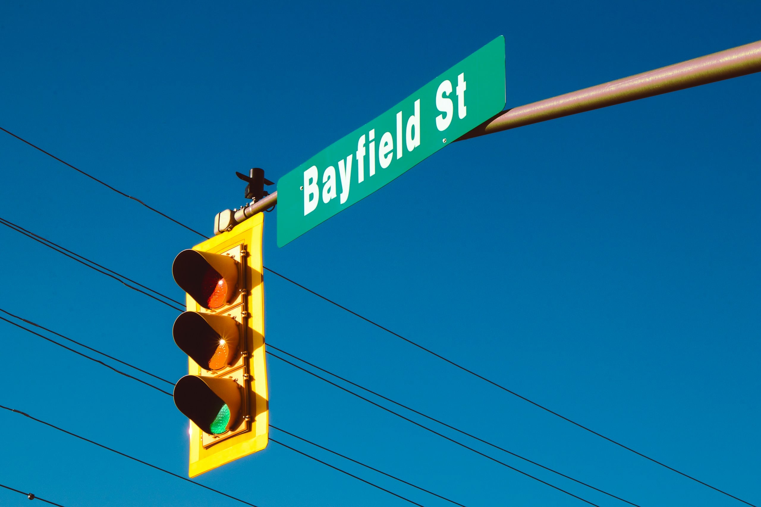 a traffic light with a street sign on it