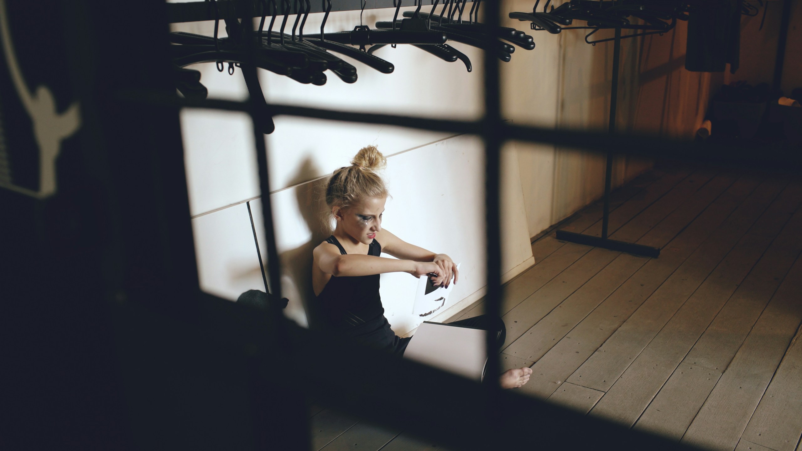 Woman sitting on floor with guitar