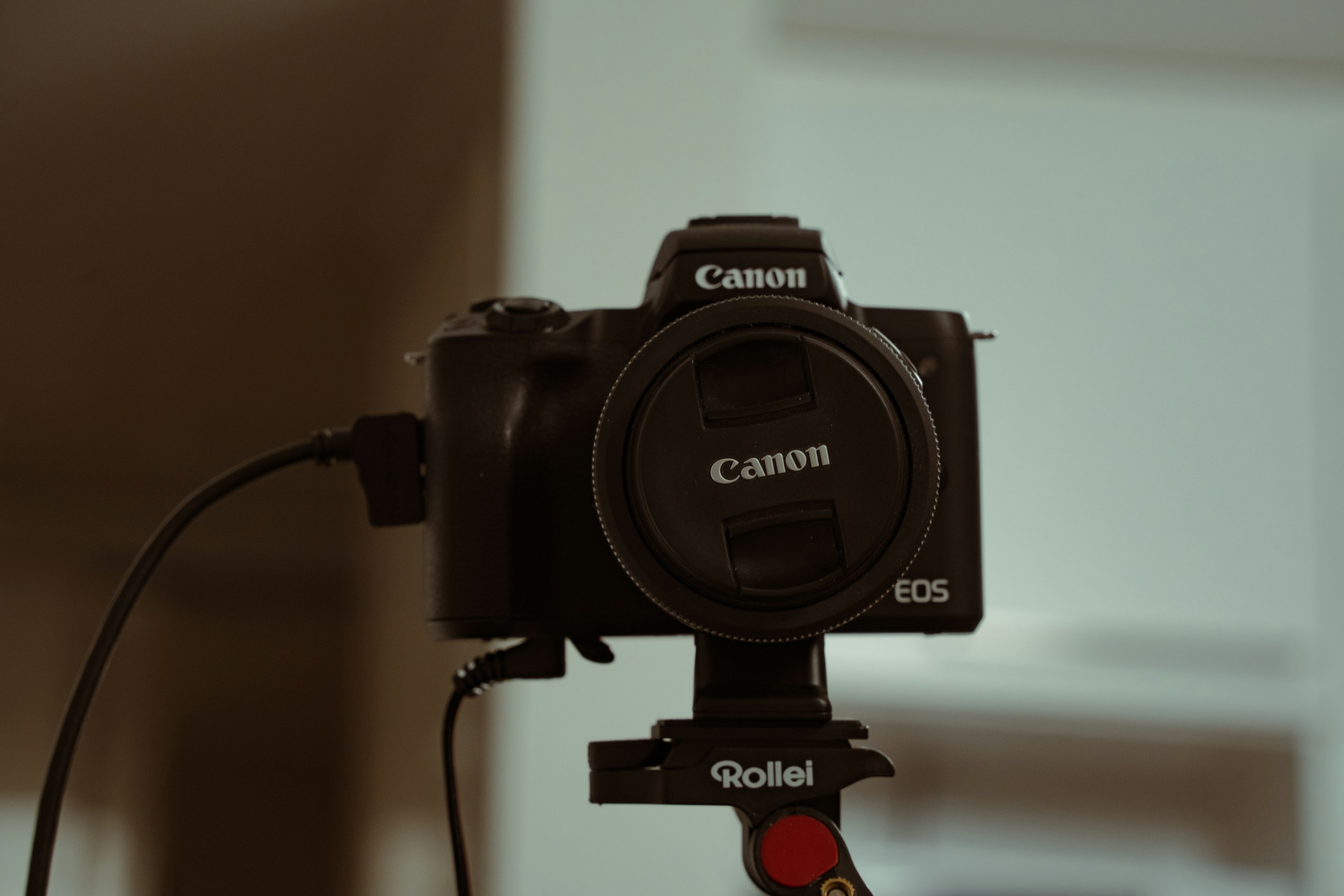 a canon camera attached to a tripod