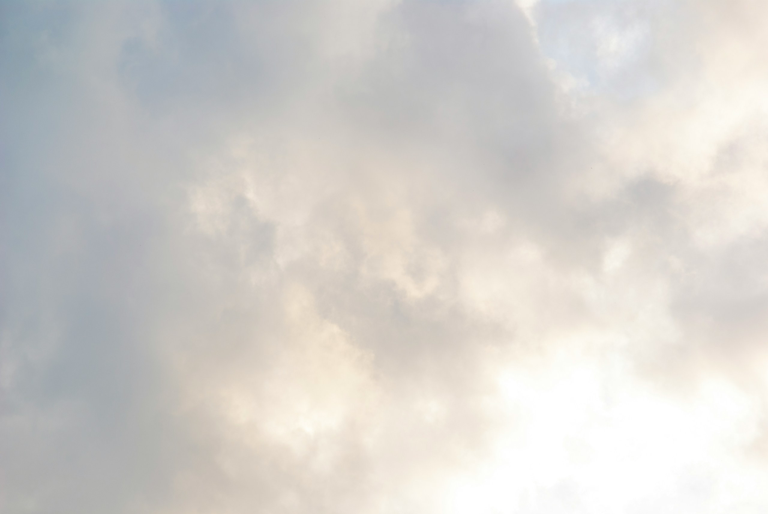 Cloudy sky with a hint of sunlight.