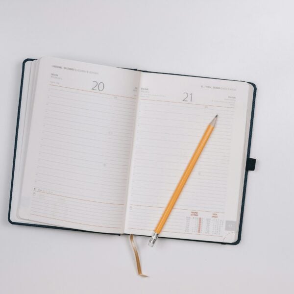pencil on opened notebook