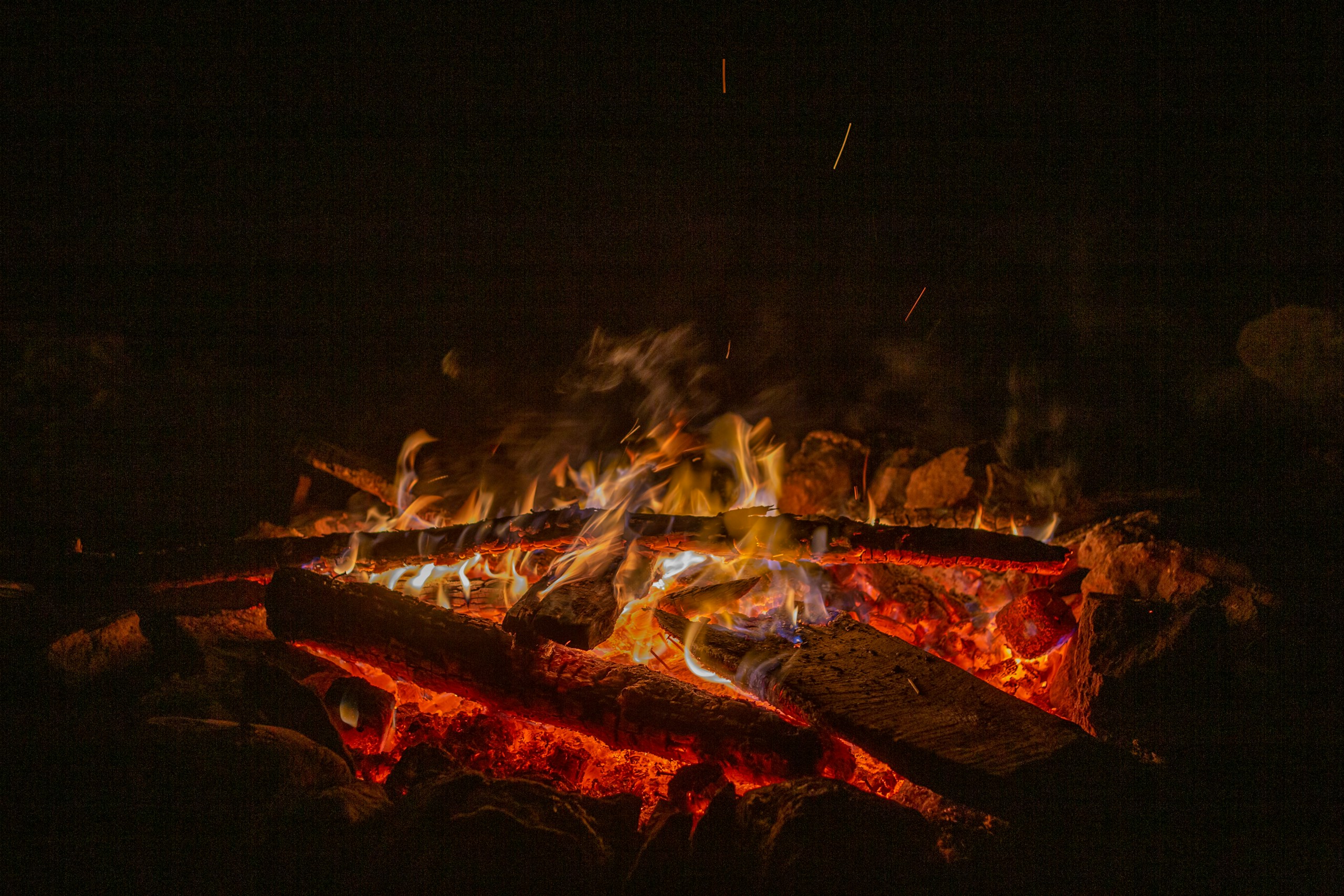 a fire burning in a pit