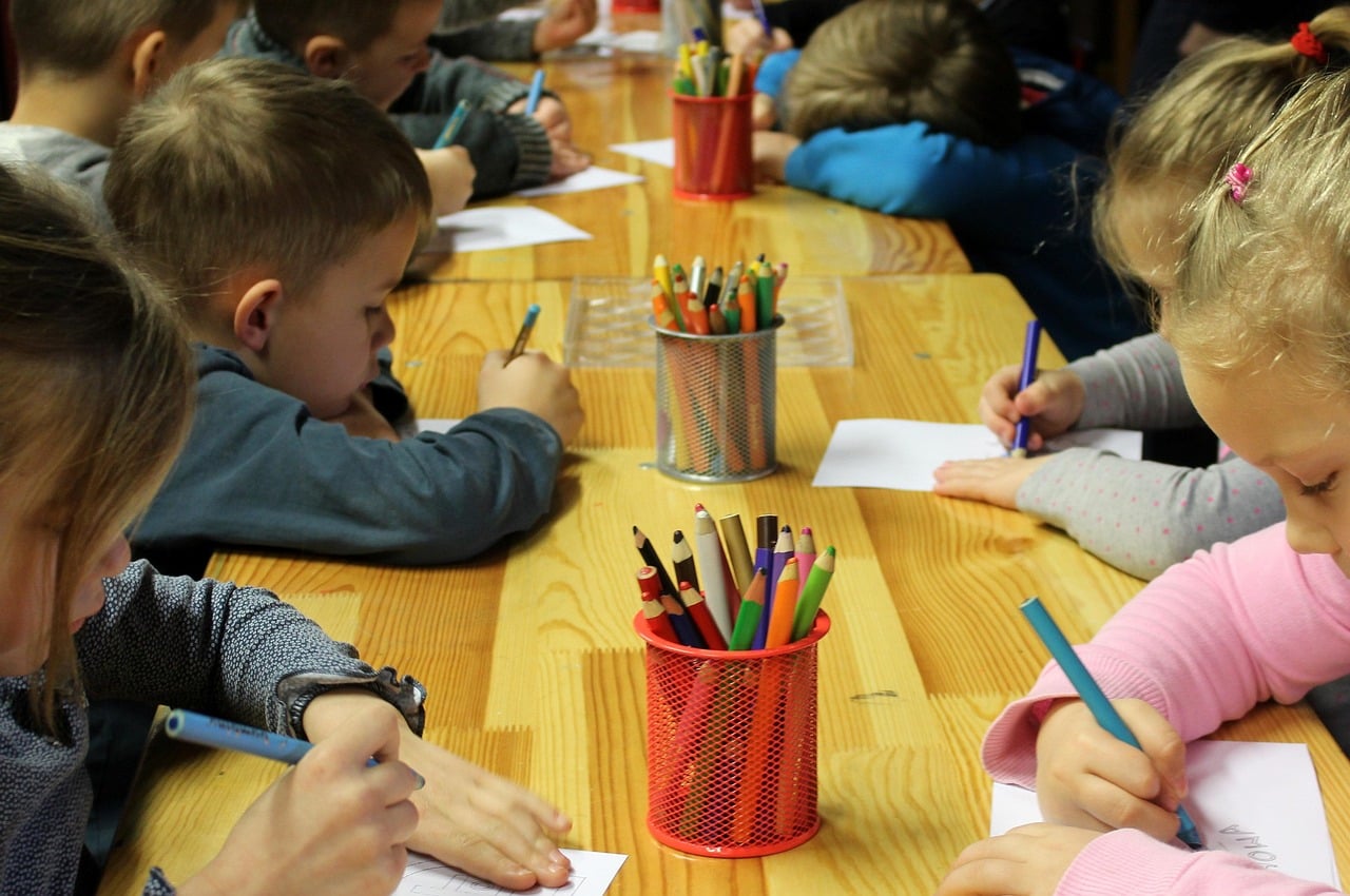 Children learning and drawing together