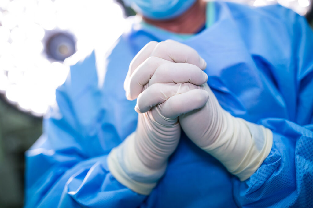 Doctor praying before surgery