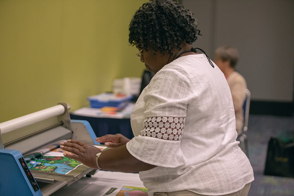 teachers convention Encounter Bible lamination party