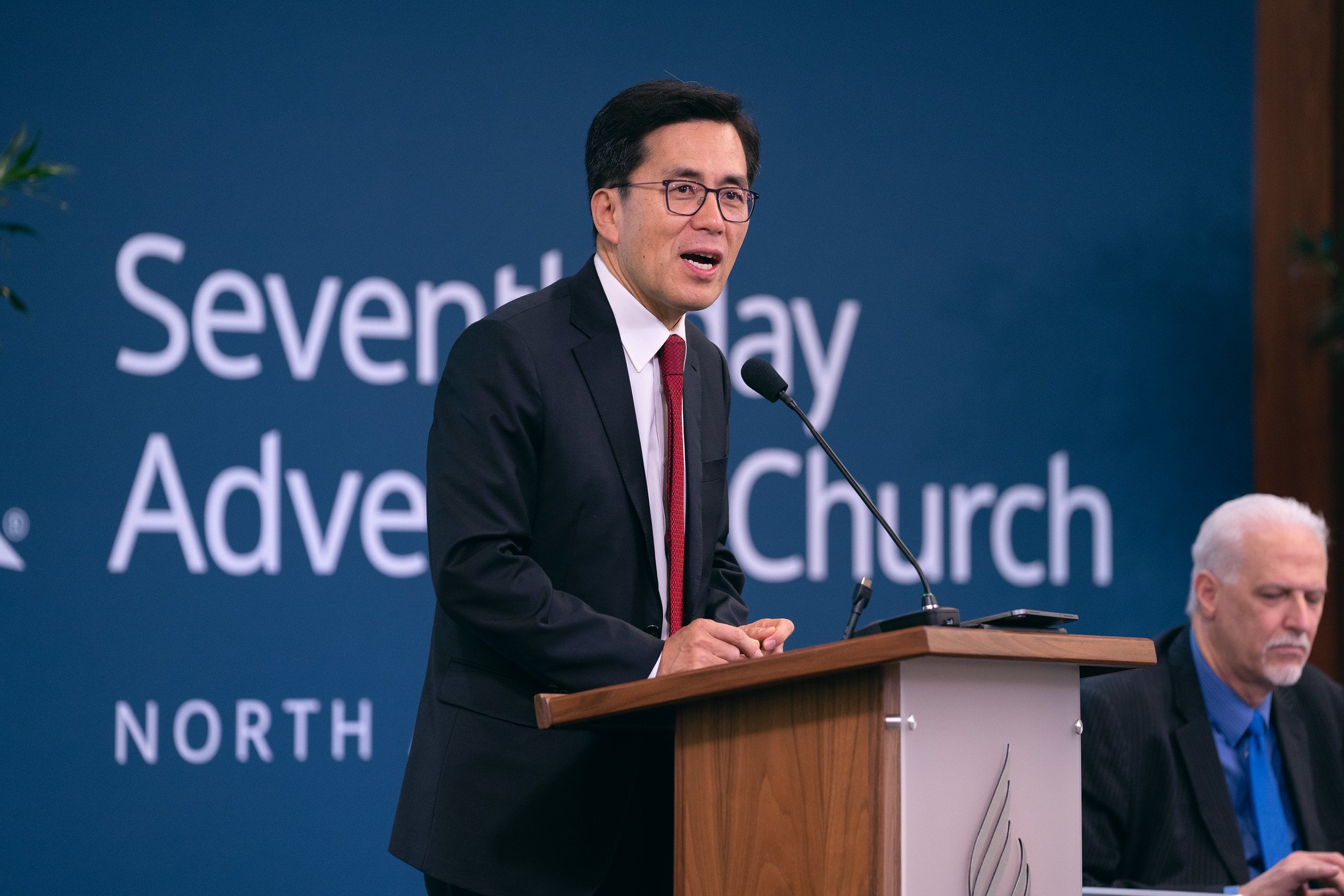 Kyoshin Ahn delivers the secretary's report during day two of the North American Division Year-End Meeting, Oct. 28, 2022.