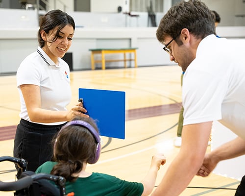 SWAU kinesiology students with community member