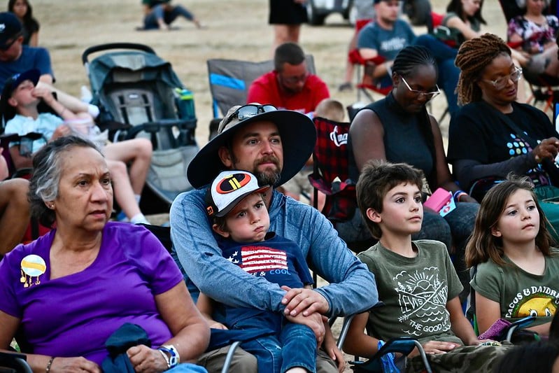 Throughout the 2024 camporee, an appreciative audience enjoyed the skillful performances of actors bringing the story of Moses to life. Pictured are community members at a special preview of the evening programming on Sunday, August 4.