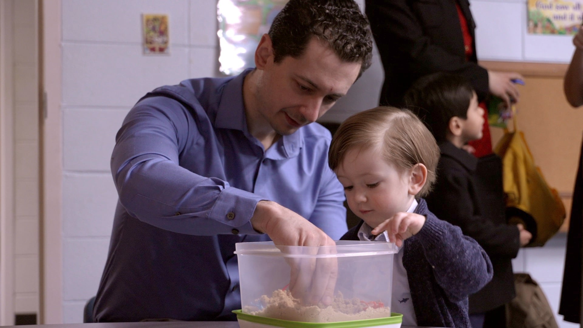 A Father and son do an interactive activity at Sabbath School