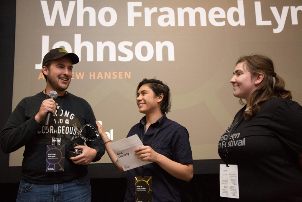 Andrew Hansen accepts the award for Best Comedy Short with his film "Who Framed Lyndon Johnson?"
