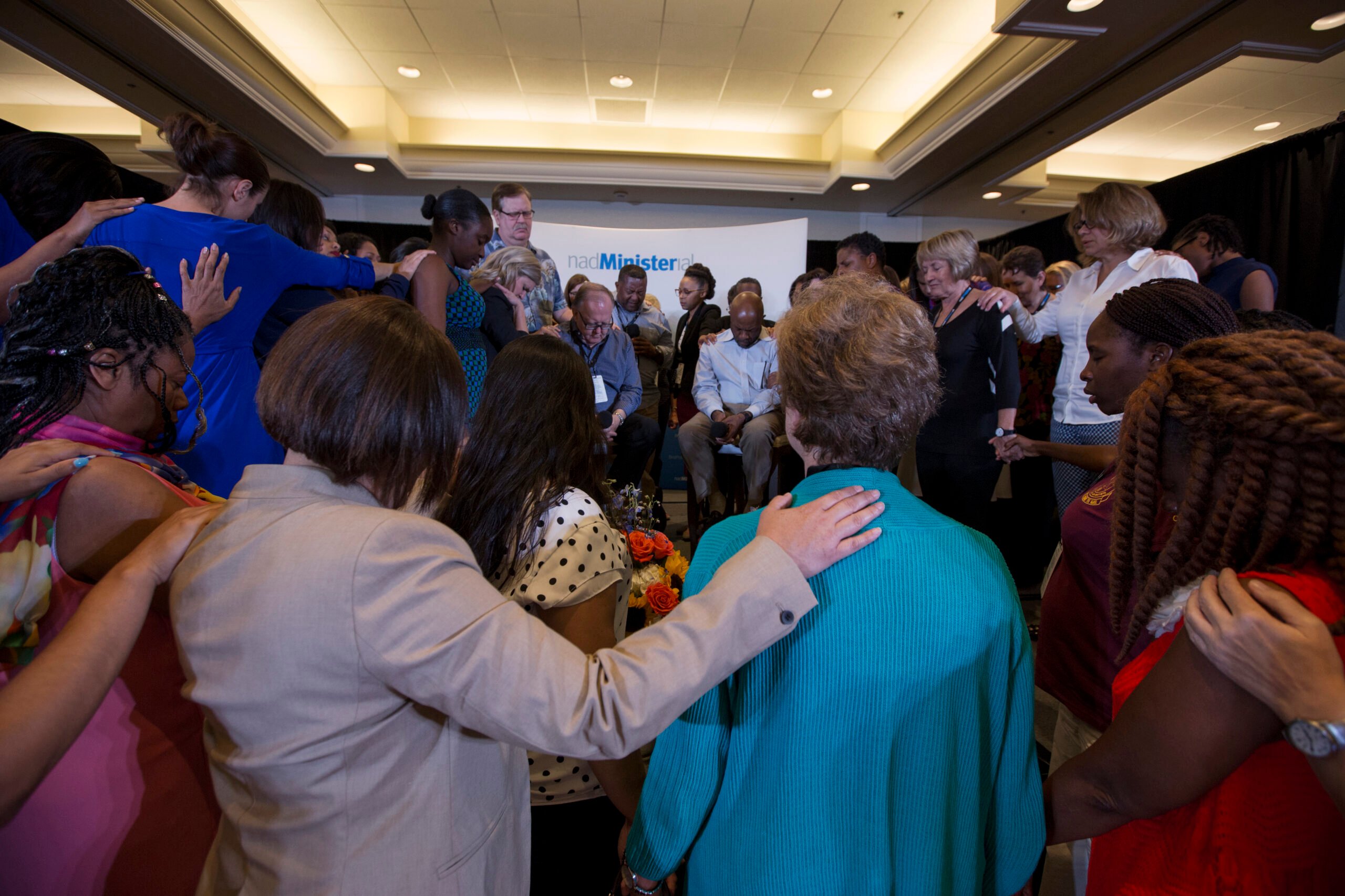 At the end of the Q&A with the president and executive secretary of NAD, Dan Jackson and Alex Bryant, the director of NAD Ministerial, Ivan Williams said a prayer over the two men. One-by-one the women clergy moved to the front of the room during the prayer to surround the leaders. 