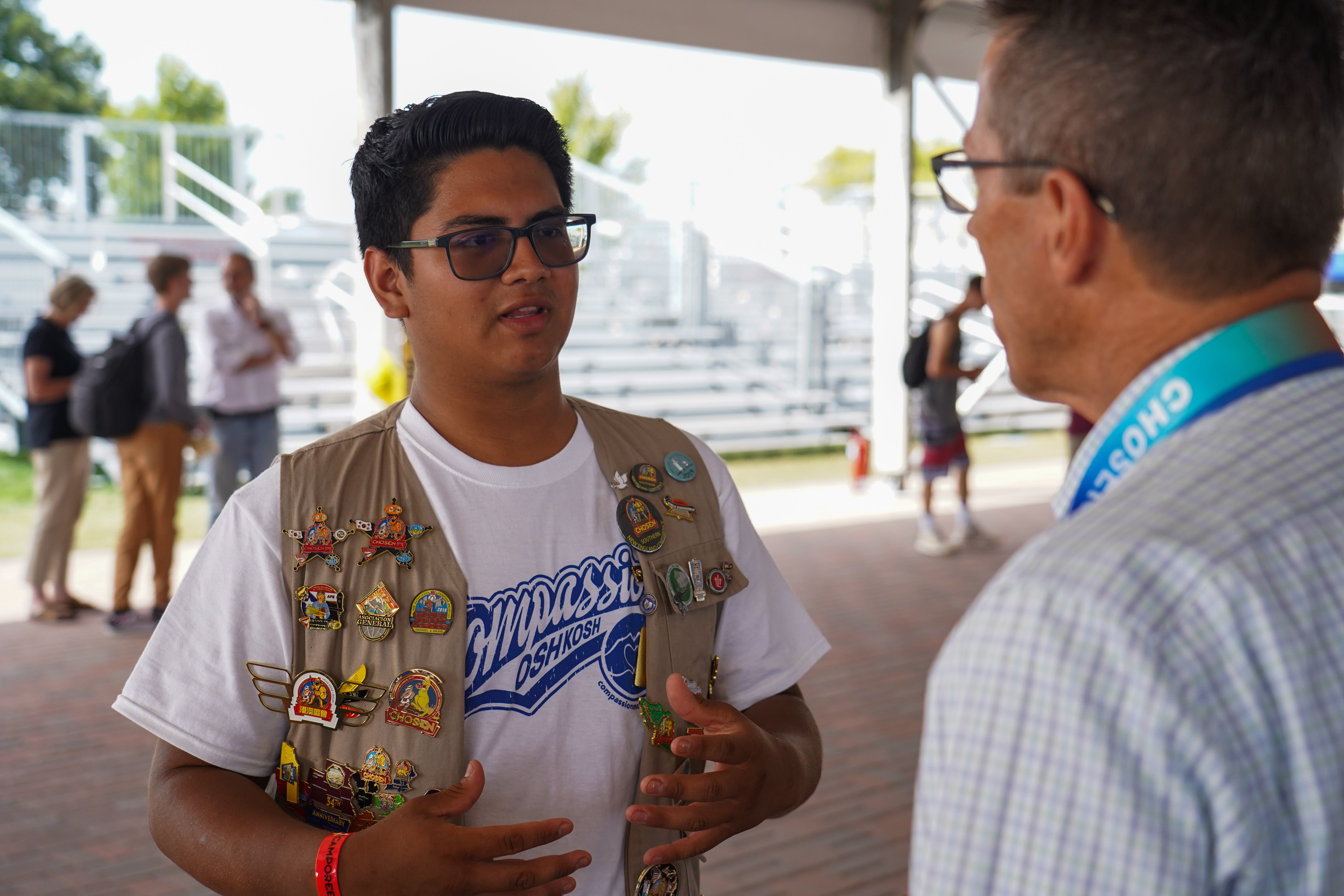 An attendee of the NextGen Ice Cream Social engages with a church leader.