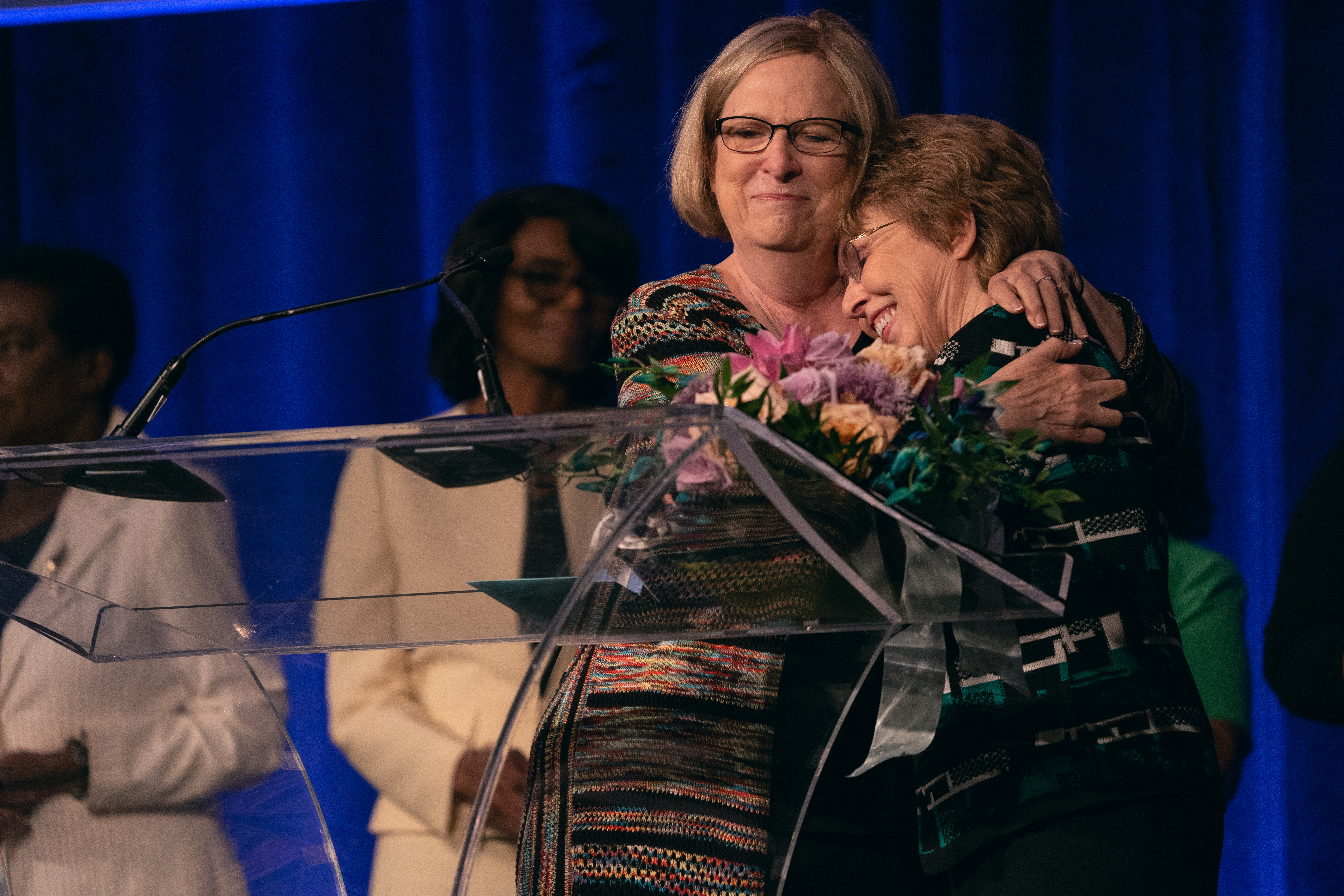 Nancy Buxton, director of Women&rsquo;s Ministries for the Mid-America Union, embraces Carla Baker, director of Women&rsquo;s Ministries for the North American Division, during the surprise farewell ceremony. Baker has served NAD for 14 years. 