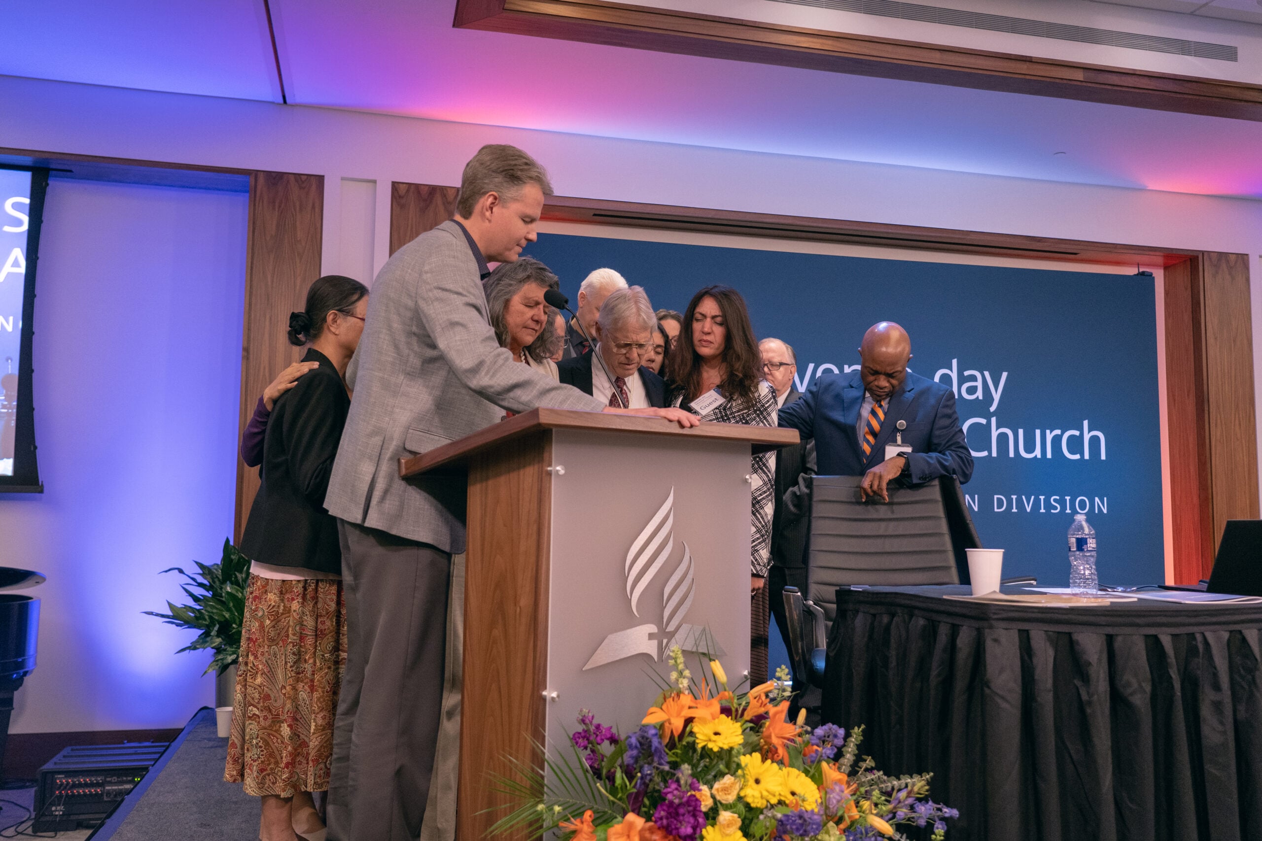 Ken Norton, president of the Guam-Micronesia Mission, prays over the parents, family, and friends of Kirsten Wolcott, the student missionary who was murdered while serving on the island of Yap 10 years ago.