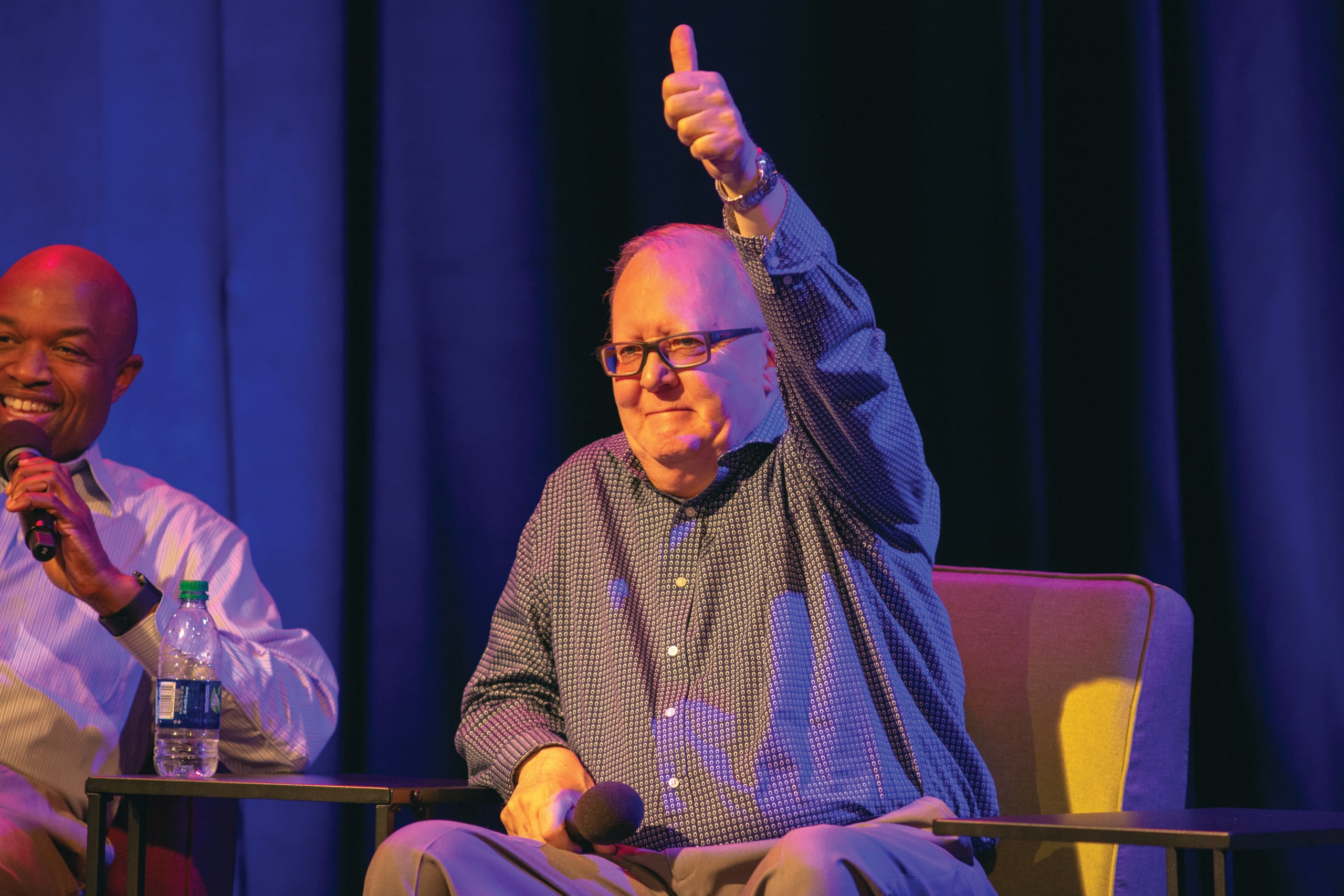 At the live-streamed event, Is This Thing On? held in Berkeley, California, in 2019, Dan Jackson gives a young adult's comment a "thumbs up."