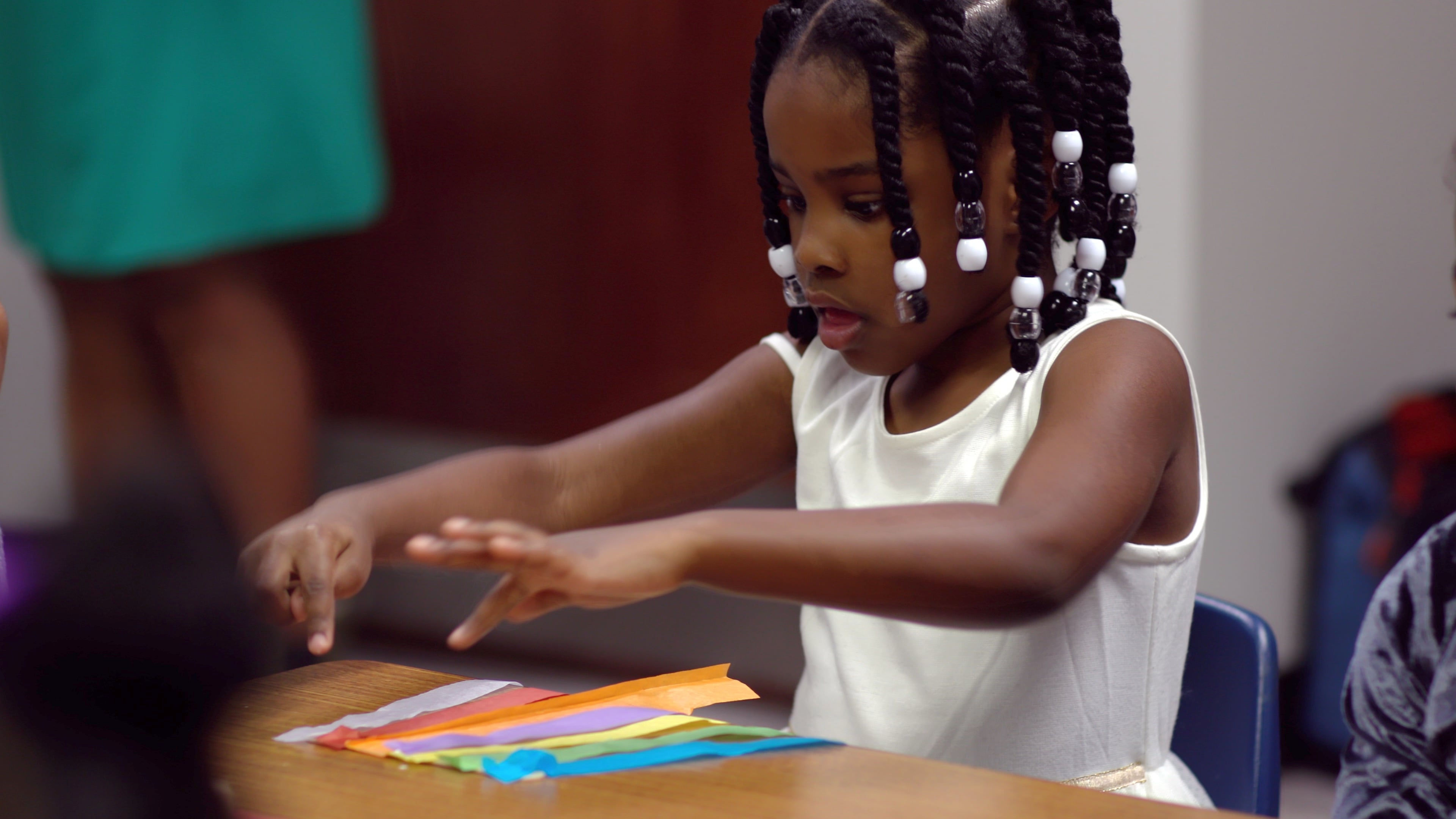 A student in the Beginners Sabbath School pilot gets crafty