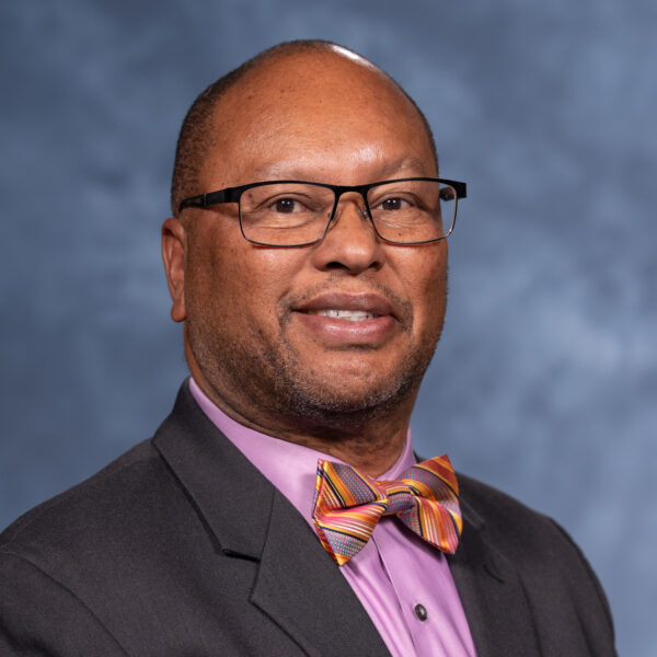 Headshot of a smiling black man