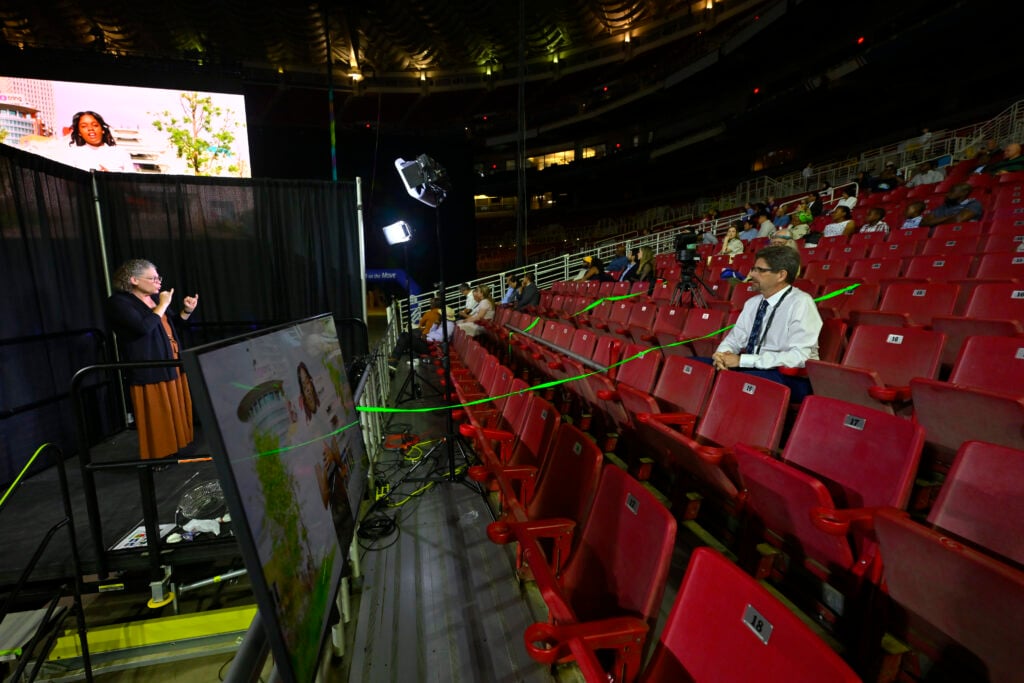 Interpreter signs for Deaf Delegate Jeff Jordan.