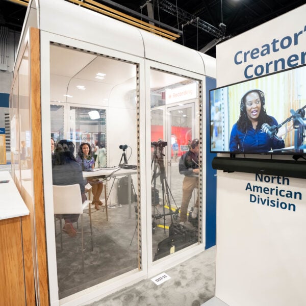 A women is shown on a TV live from the "Creator's Corner" studio space.