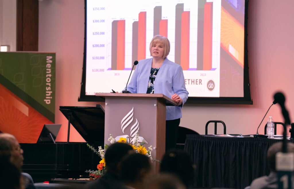 Businesswoman presents a powerpoint on finance before a work meeting.