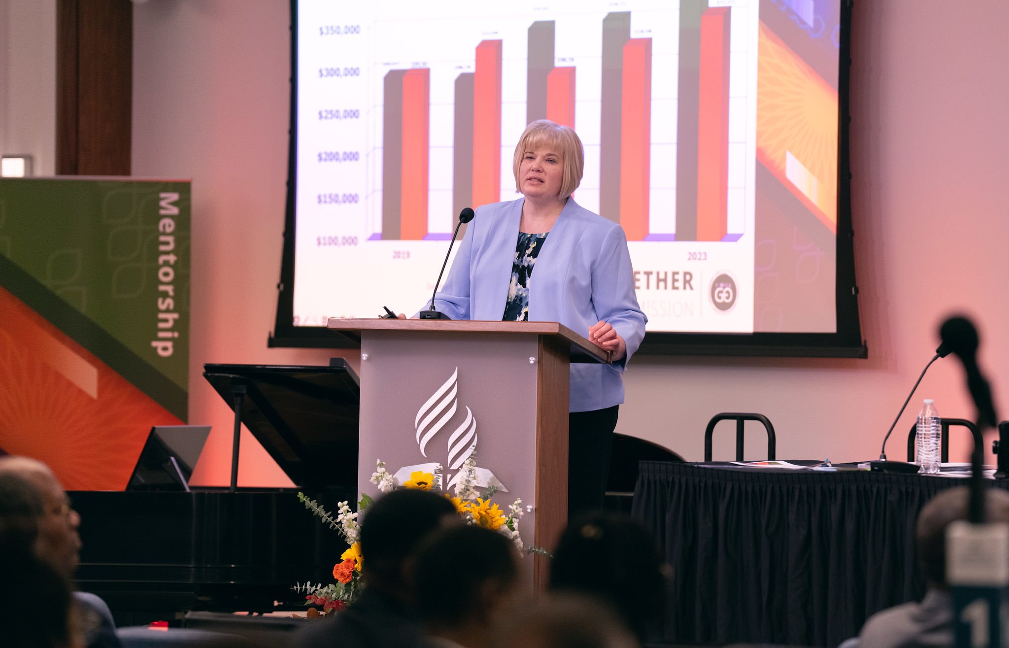 Businesswoman presents a powerpoint on finance before a work meeting.